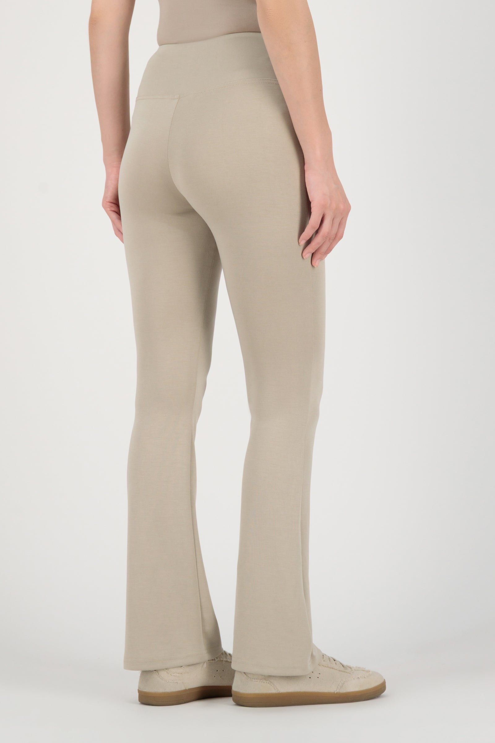 Back view of the FARES Buttery Flared Leggings in Stone highlighting clean lines and the comfortable fit of these leggings.