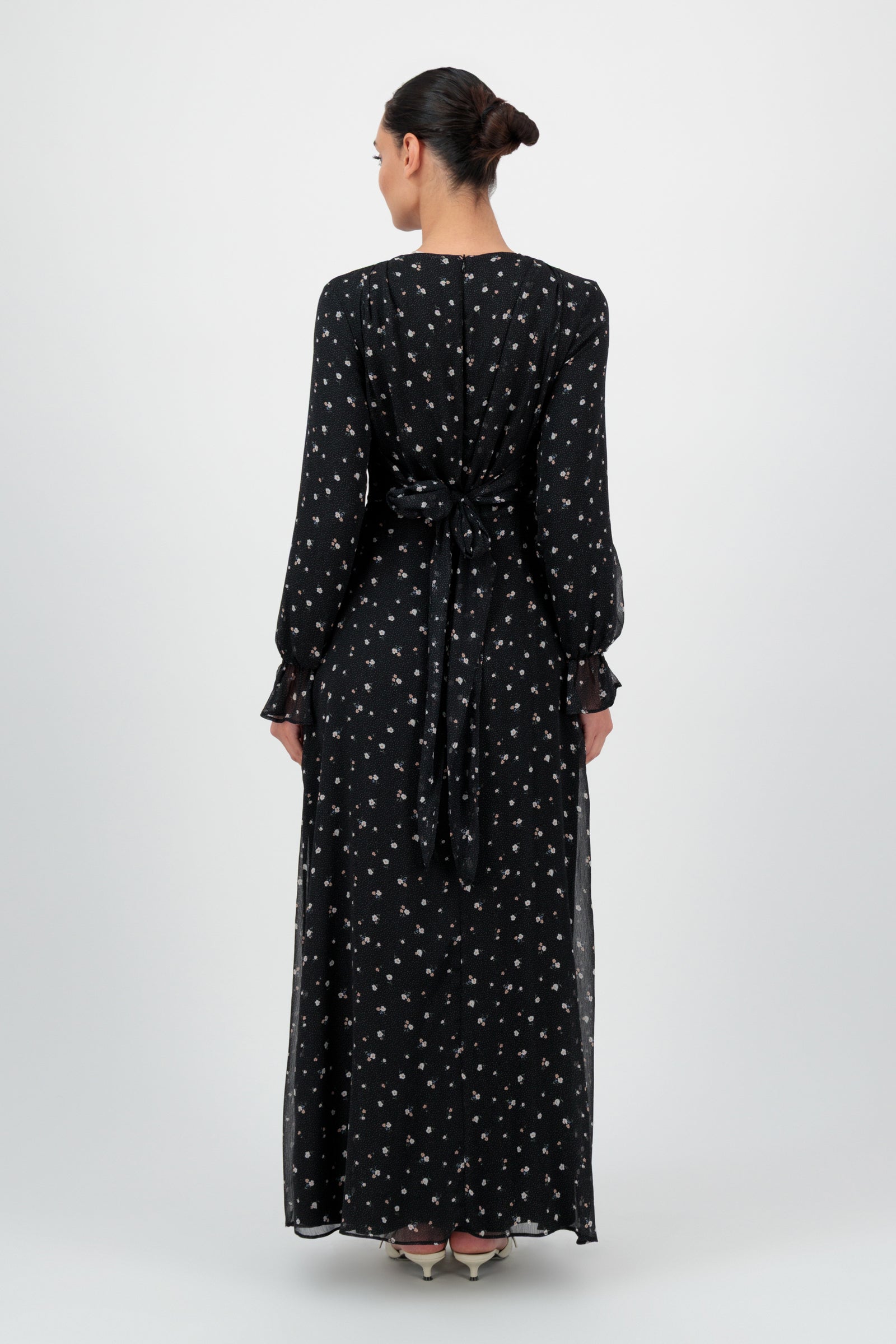Back view of the FARES Waist Wrap Chiffon Dress in Nightbloom shows the full-length silhouette of this refined long sleeve dress.