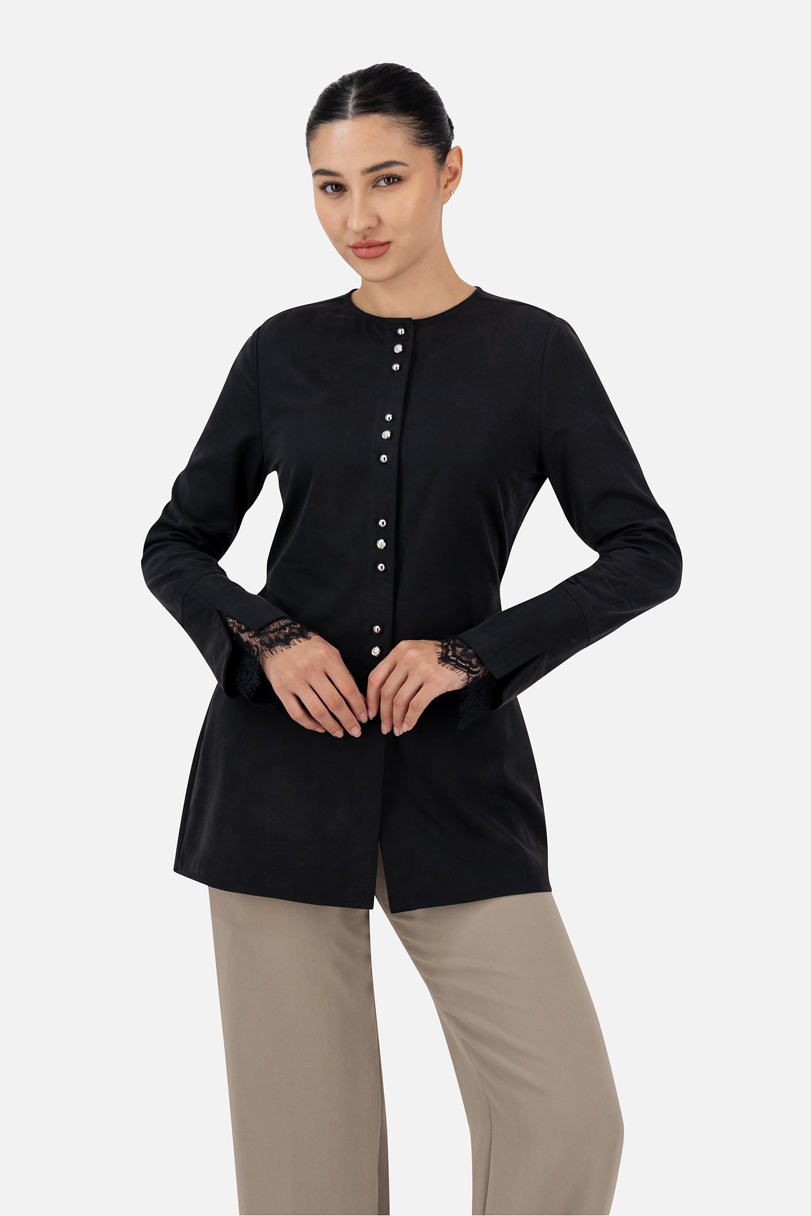 Woman wearing the Black button-up long-sleeve top, front view.