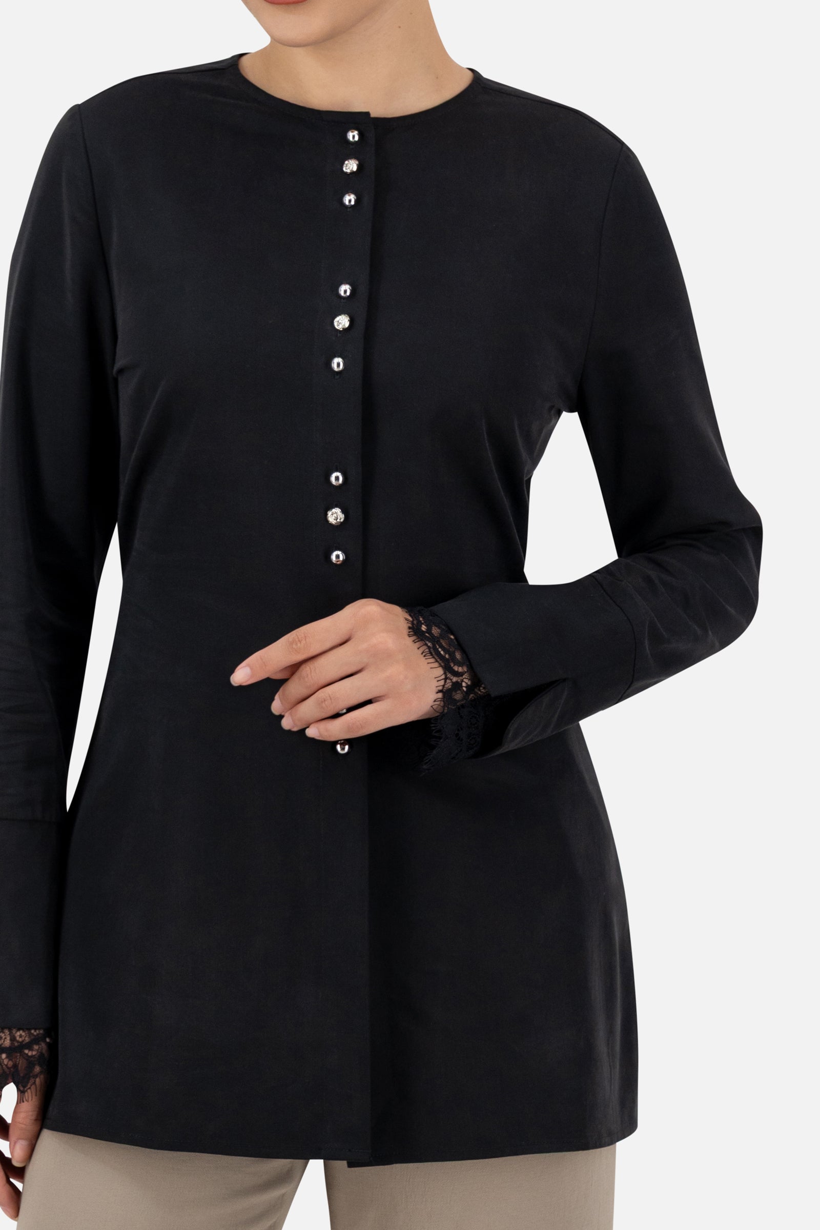 Close-up of the buttons and lace detail on the Black button-up long-sleeve top.