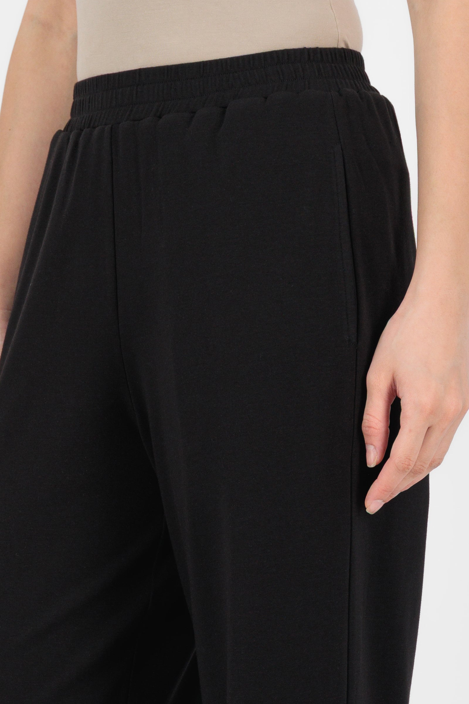 Close-up of the Elastic Waist Straight Leg Trouser in Black showing the soft fabric, elastic waistband, and clean stitching that enhance the quality of this straight leg trouser.
