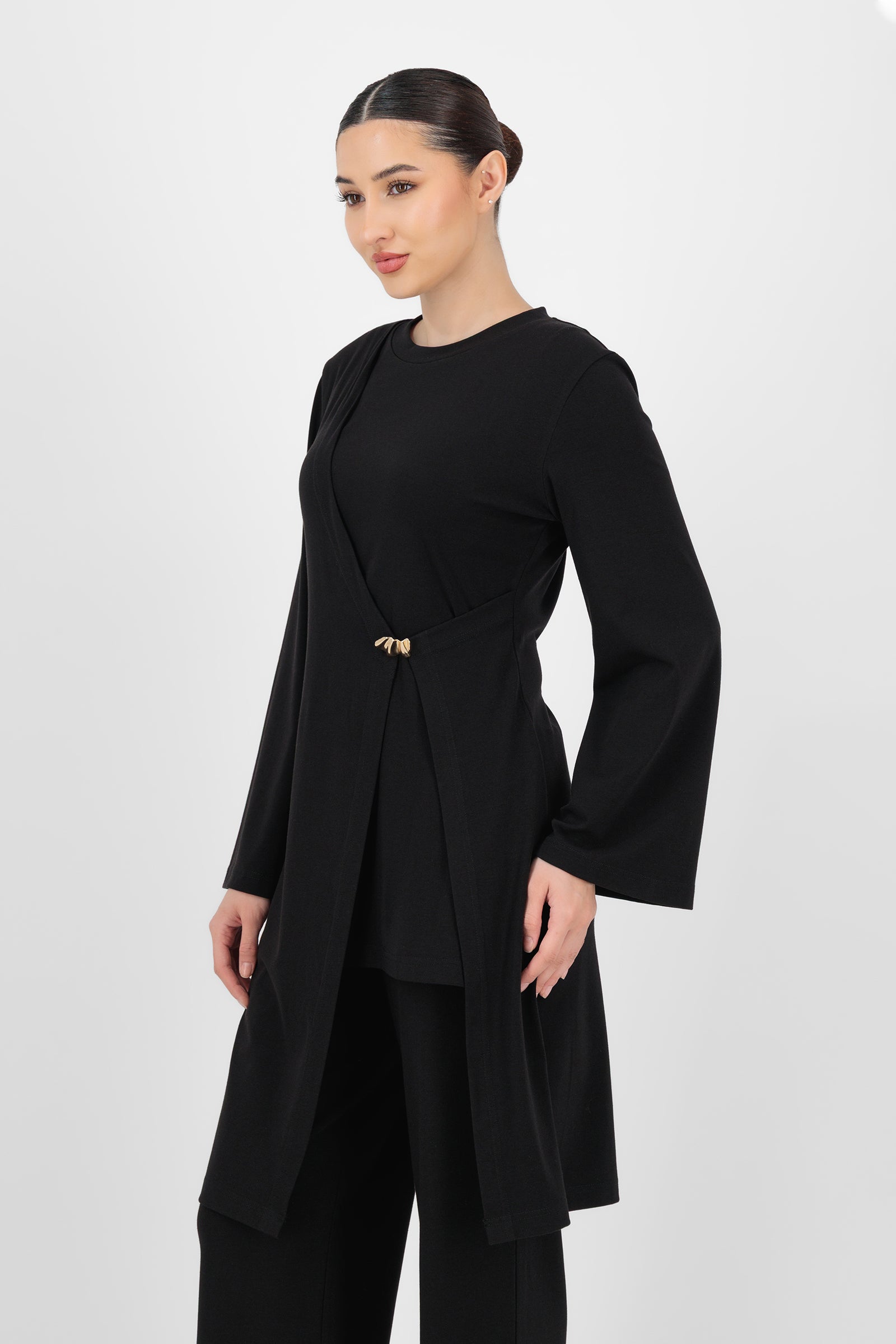 Alternate front pose of the Black Gold Accent Wrap Top capturing the gold accent detail and the natural shape that makes it a standout among wrap tops.