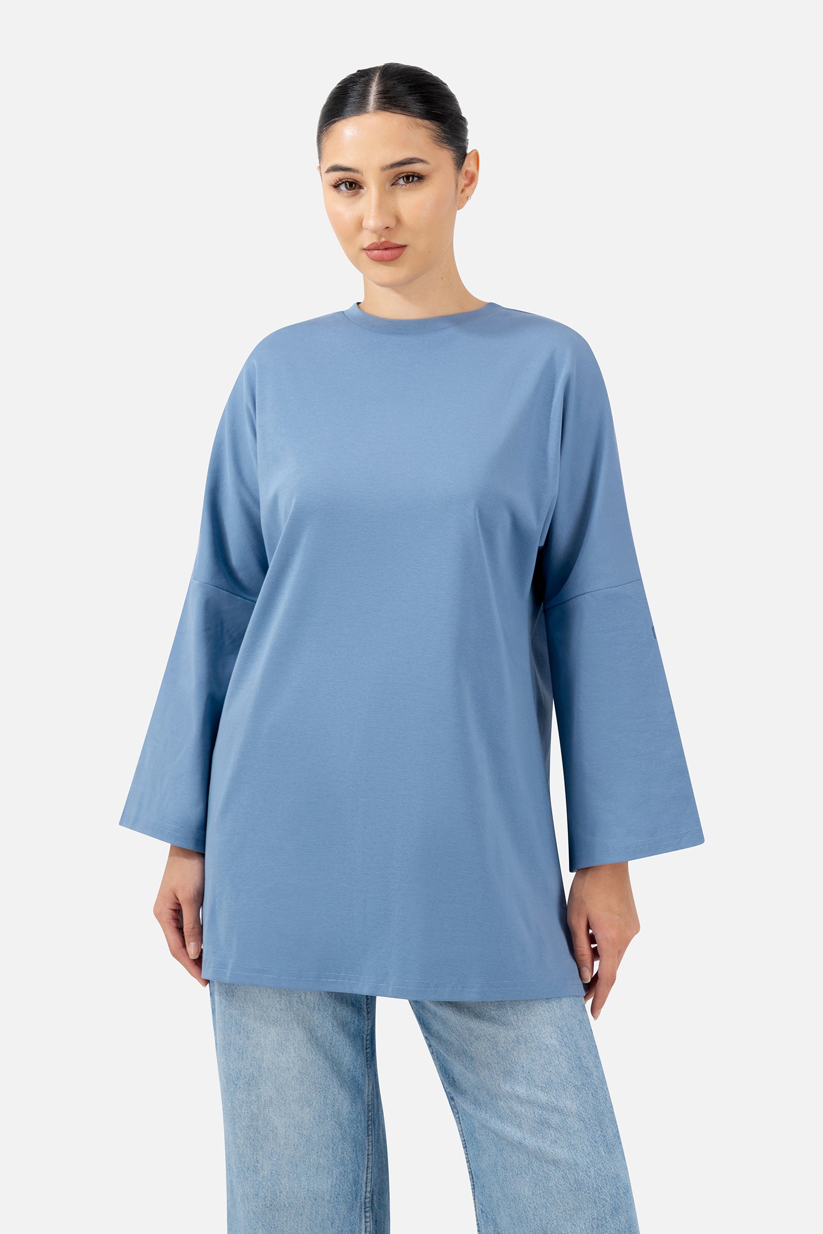Front view of the Denim Blue Cotton Long-Sleeve Tee with an oversized fit and relaxed silhouette.