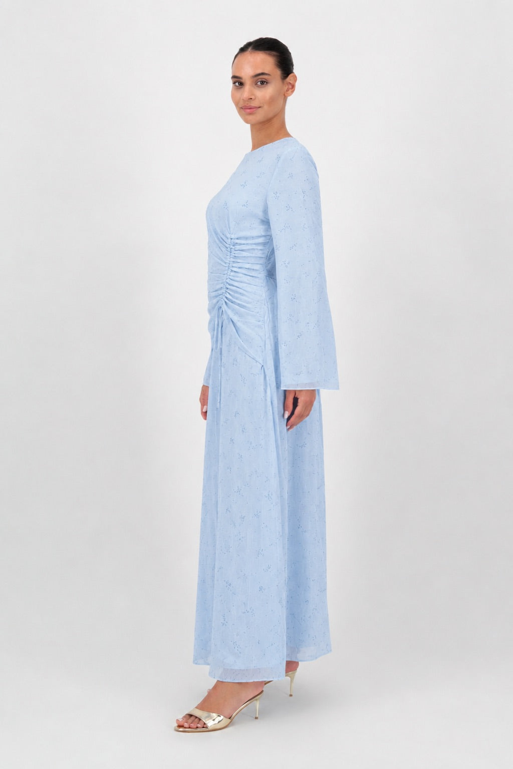 Side profile of the Skyflower chiffon dress on the model.