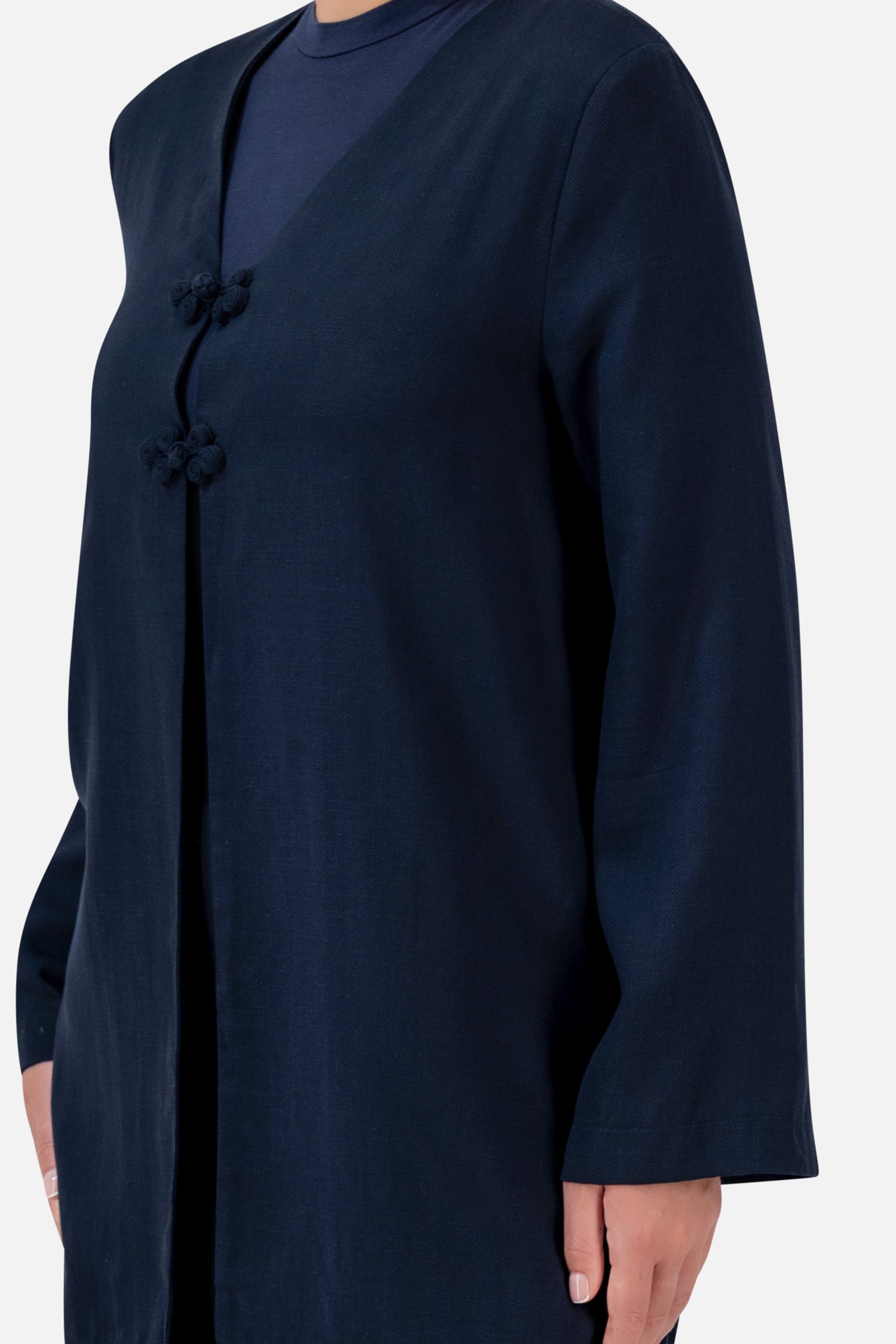 Closer view of the FARES Knot Detail Cardigan in Navy, highlighting the knotted front closures and flowing wide sleeves.