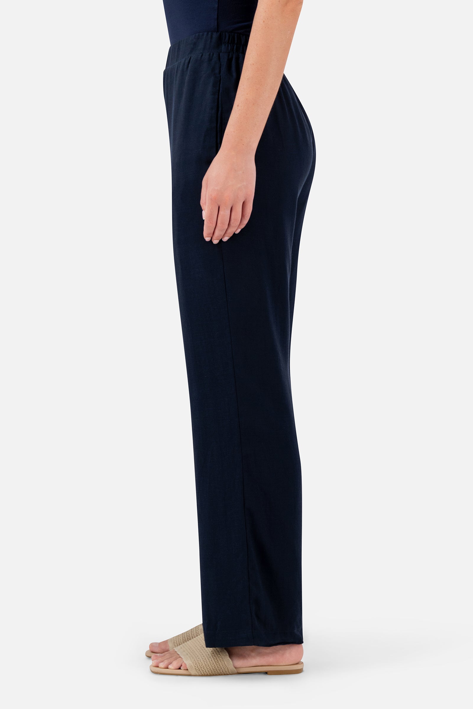 FARES Relaxed Fit Pants in Navy shown from the back, highlighting the easy straight silhouette and gathered elasticated waistband.