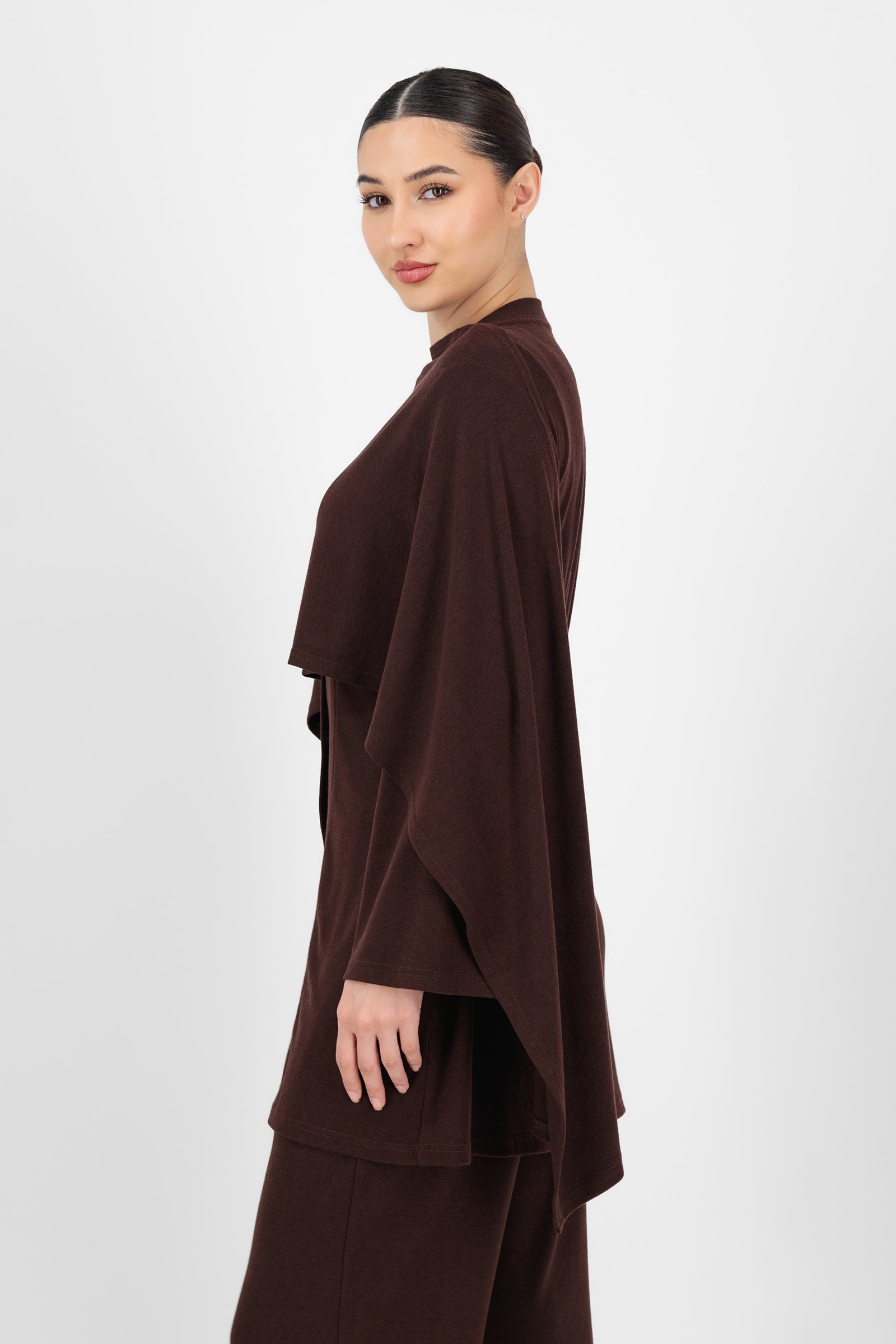 Side angle of the Draped Shawl Knit Top in Espresso capturing the draped neckline and soft texture that add elegance to simple tops for women.
