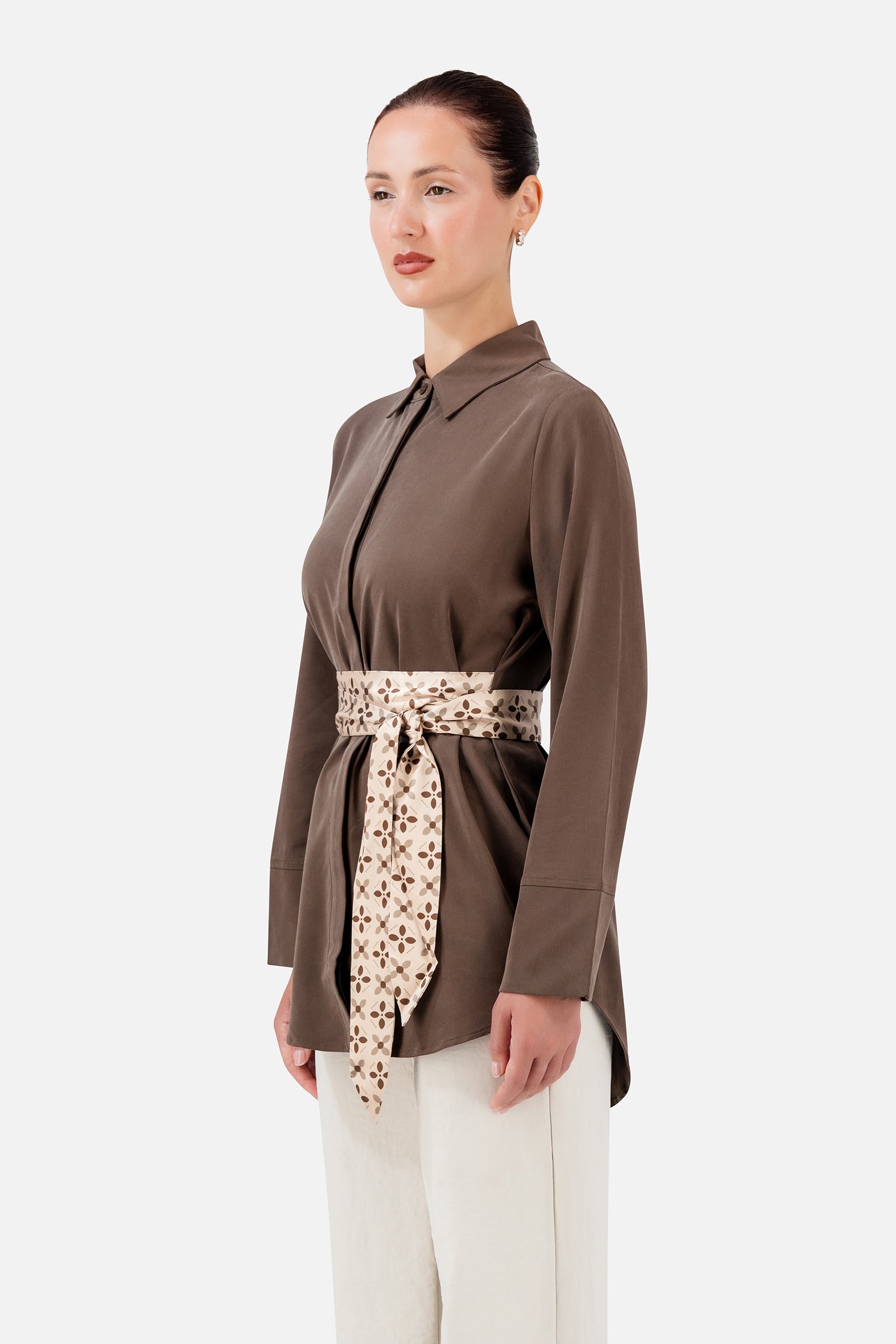 FARES Printed Wrap Belt Button Up in Mocha shown at an angle, highlighting the classic collar, long sleeves and contrasting printed wrap belt.