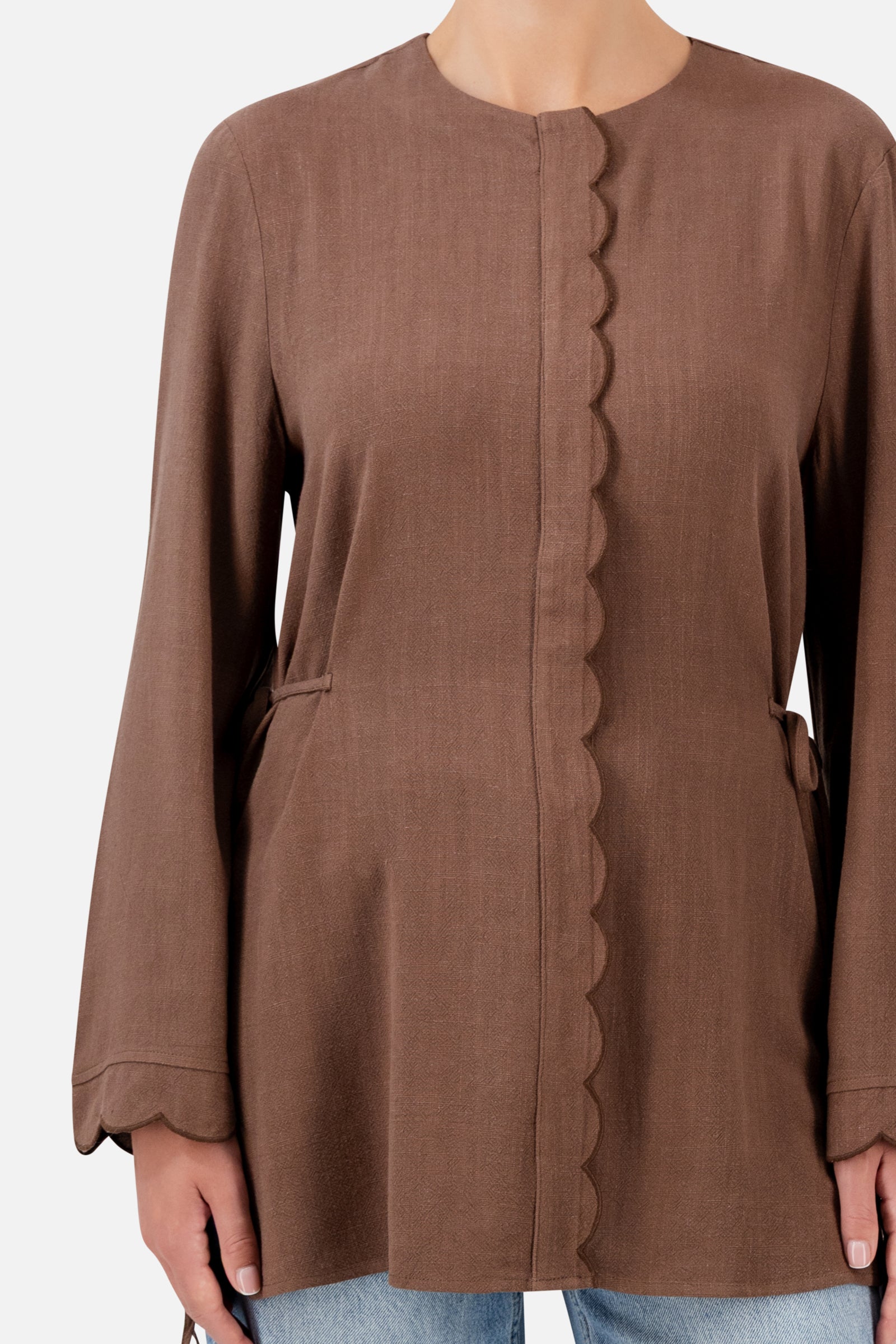 Closer view of the FARES Scalloped Detail Linen Blend Top in Fudge, showing the delicate scalloped edging, linen blend texture and side ties.