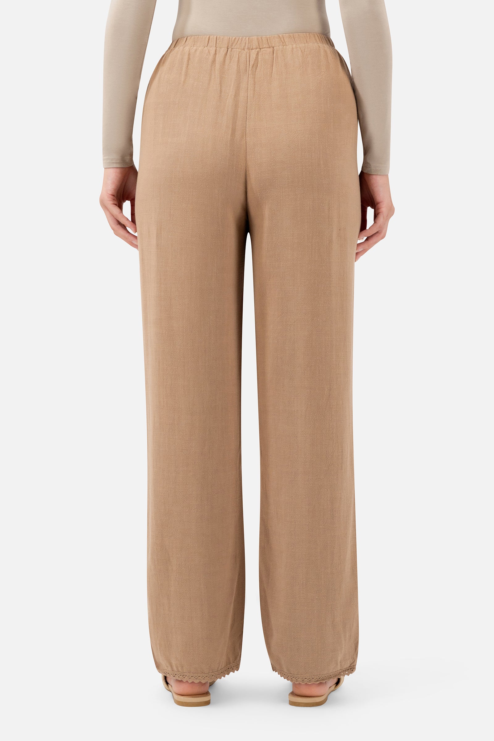 Back view of the Brownstone linen pants for women showcasing the relaxed fit and full-length design.