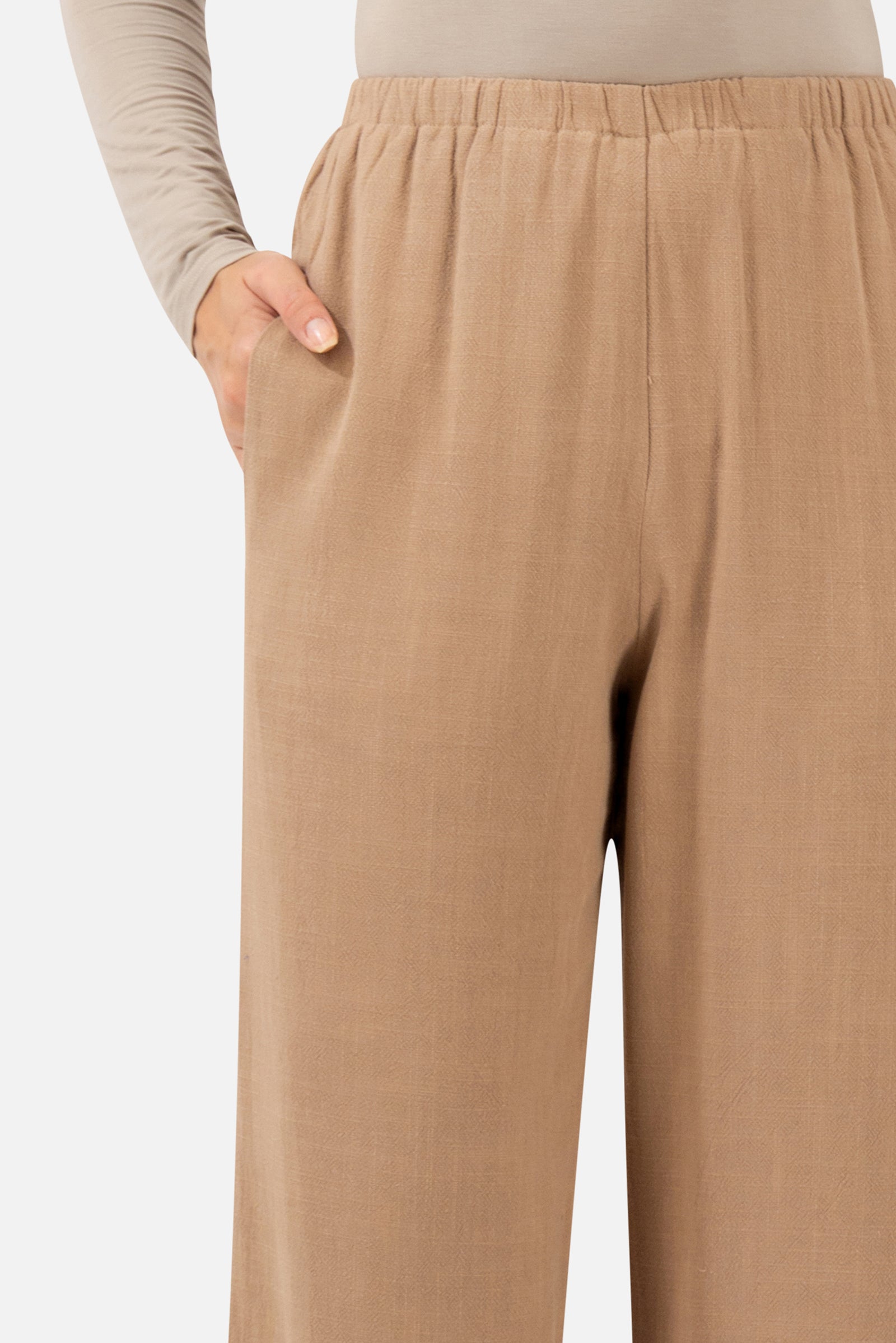 Close-up of the pocket and textured fabric detail on the Brownstone Relaxed Fit Pants.