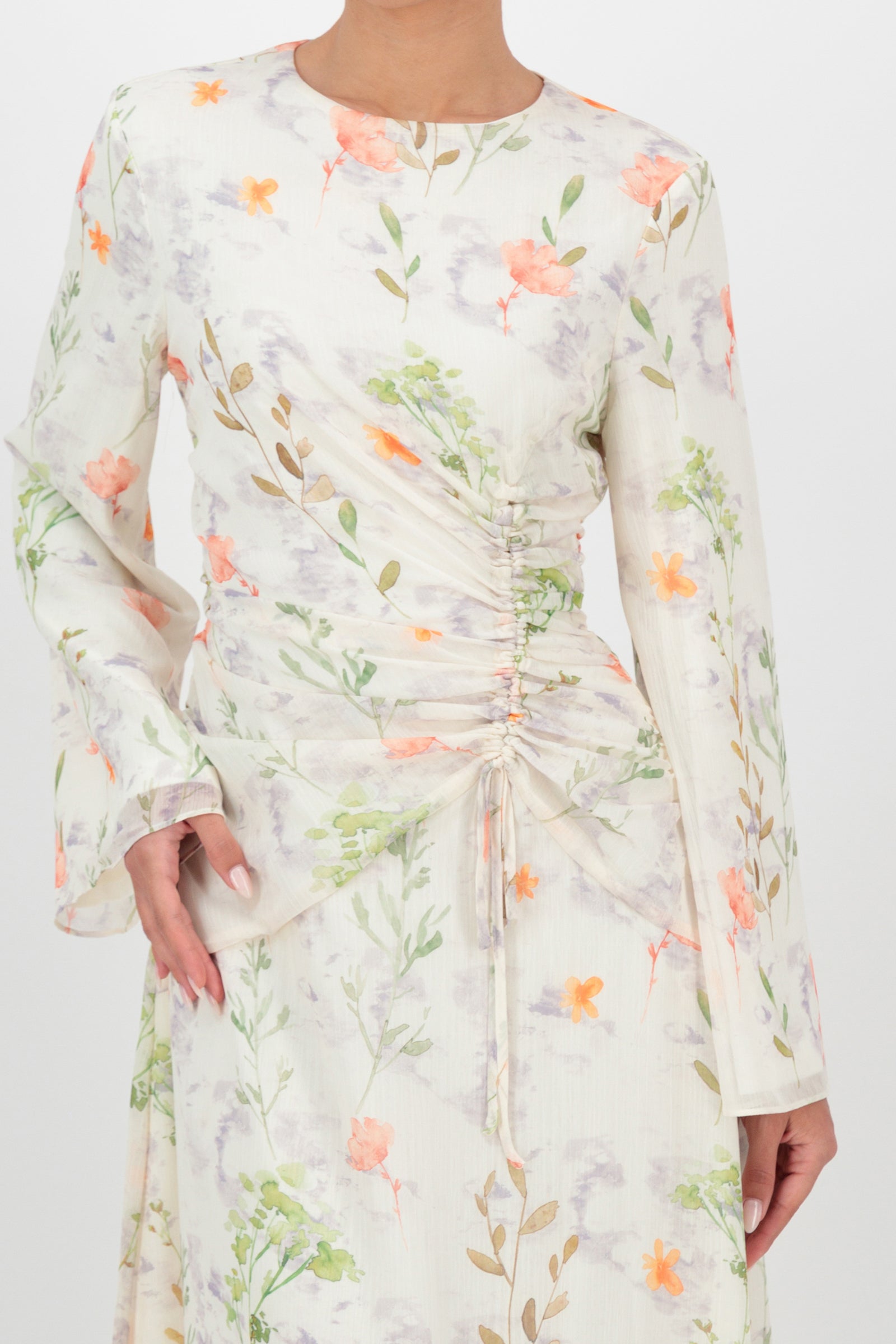 Close-up of the FARES Scrunched Waist Chiffon Dress in Wildflower captures the delicate floral print and scrunched waist detail of this chiffon dress.