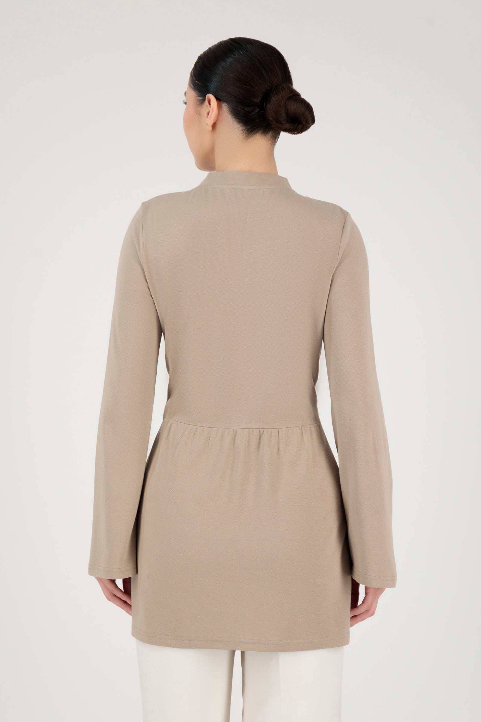 Back view of the FARES Tailored Knit Tunic in Truffle highlighting balanced tunic lines and a smooth, tailored fit.