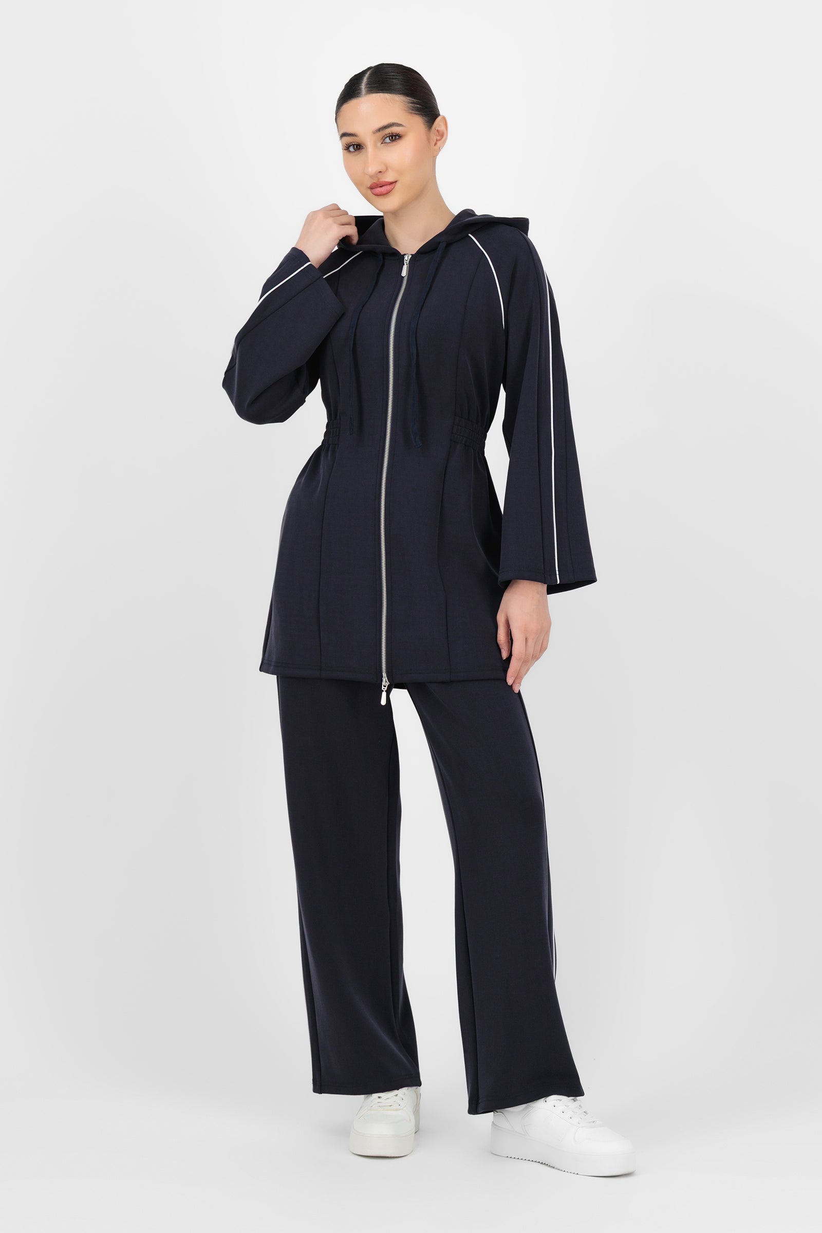 Full-body shot of the model wearing the Midnight Blue Buttery Straight Leg Jogger styled casually for a relaxed yet put-together look that suits both jogger pants and everyday basics.