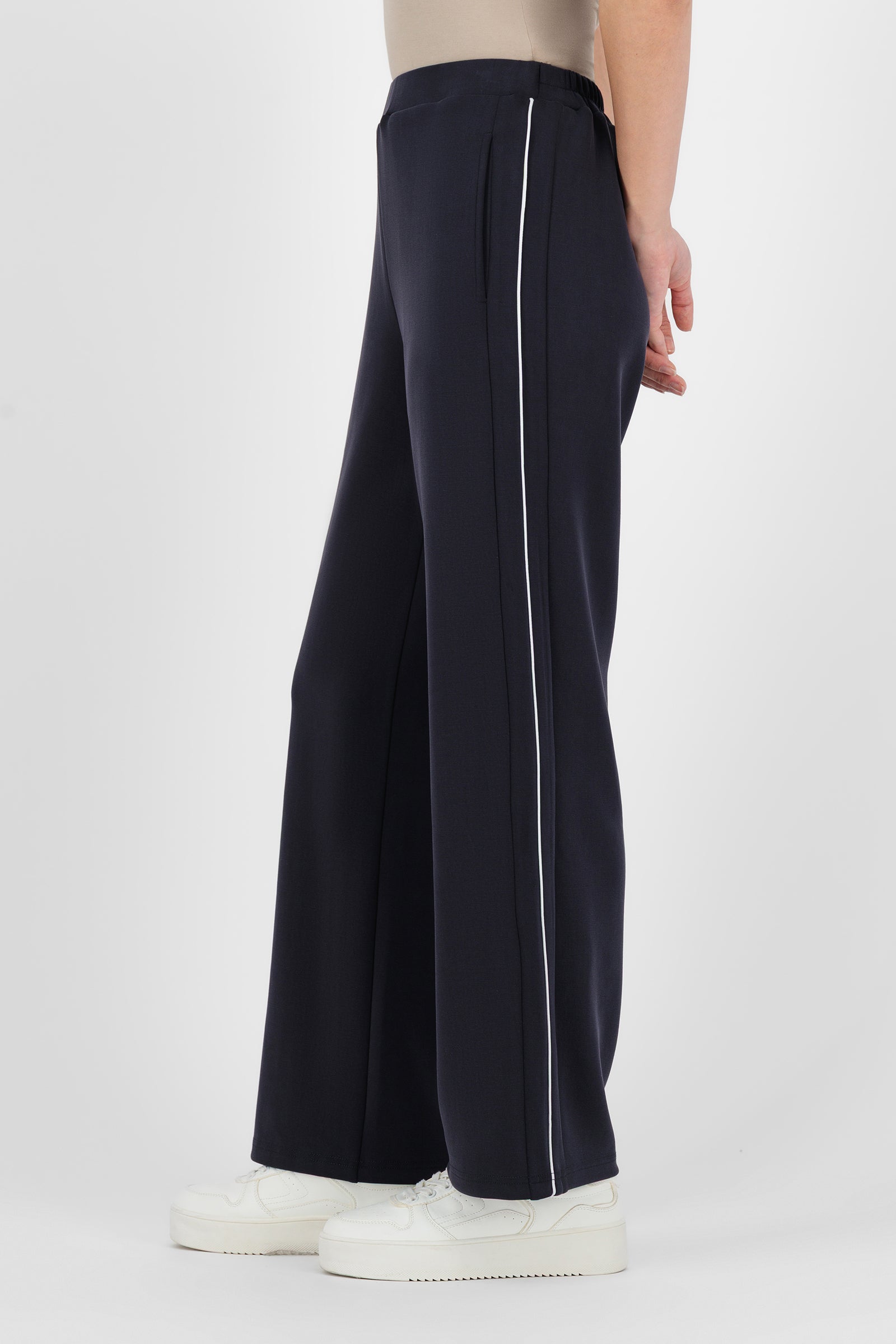 Side angle of the Buttery Straight Leg Jogger Midnight Blue showing the soft drape and streamlined silhouette that give these straight leg pants a polished feel.