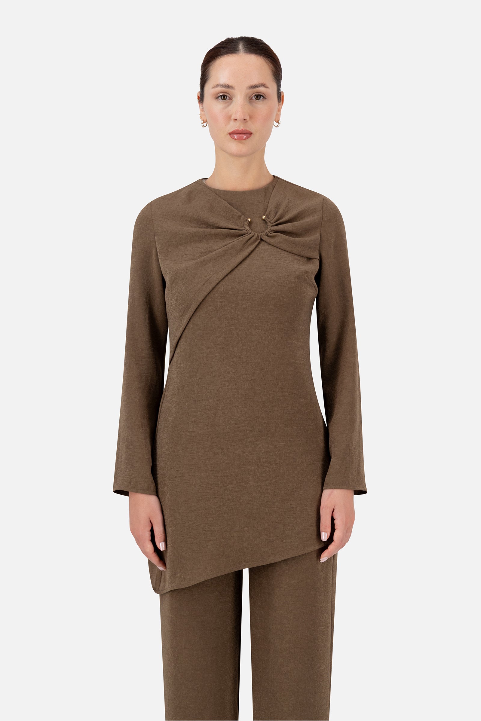 Woman wearing the Espresso gathered ring asymmetric tunic, front view.