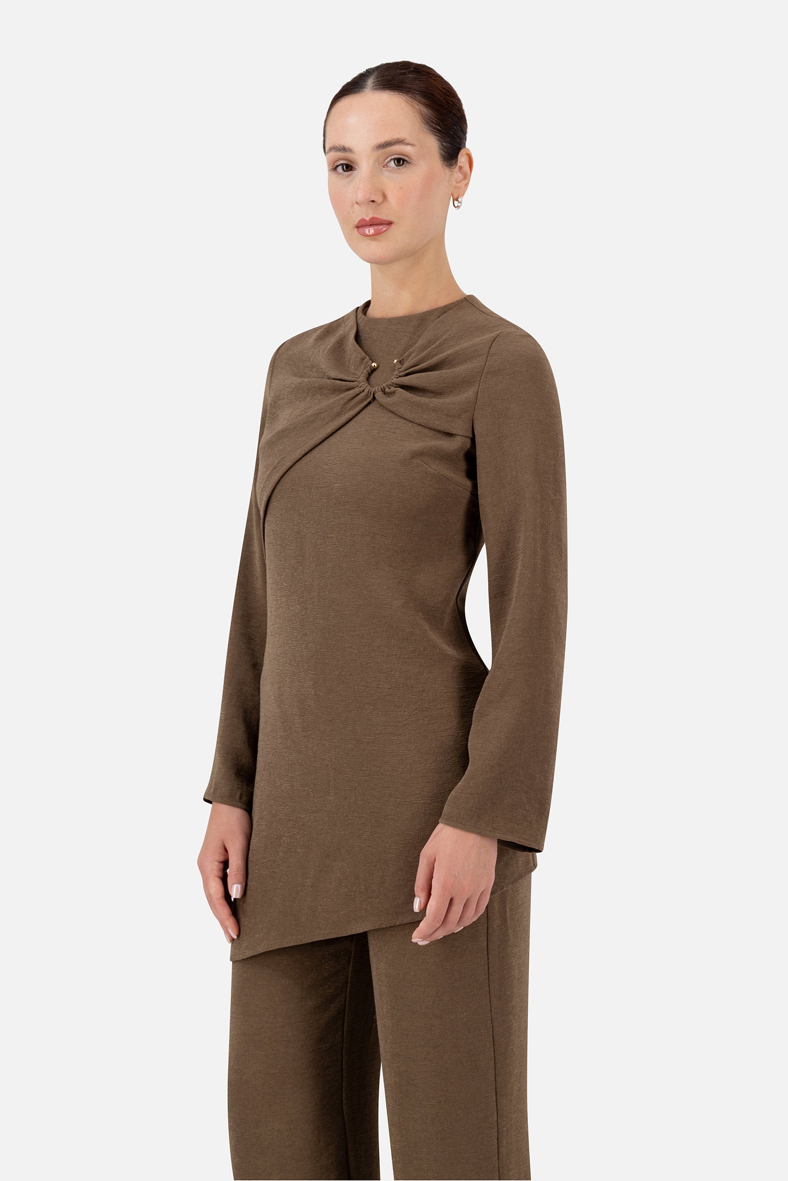 Side profile of the Espresso asymmetric tunic on the model.