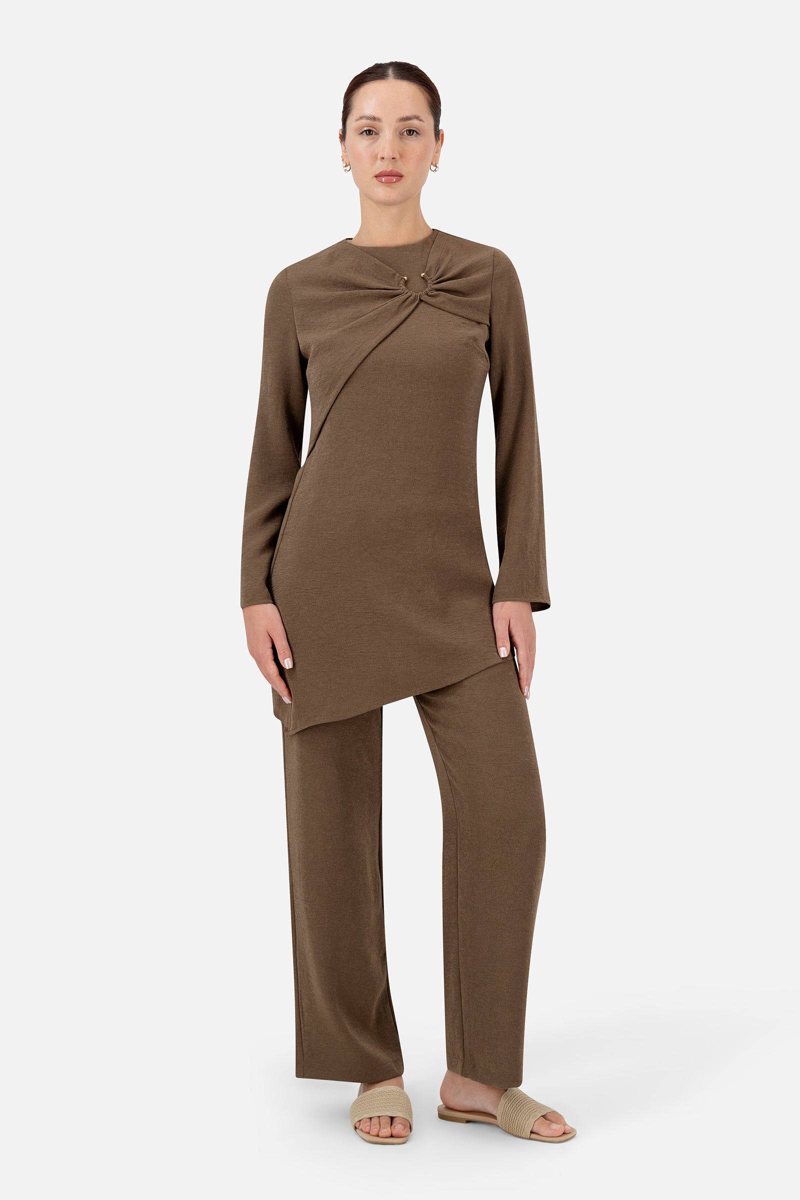 Full-length view of the woman wearing the Espresso asymmetric tunic.