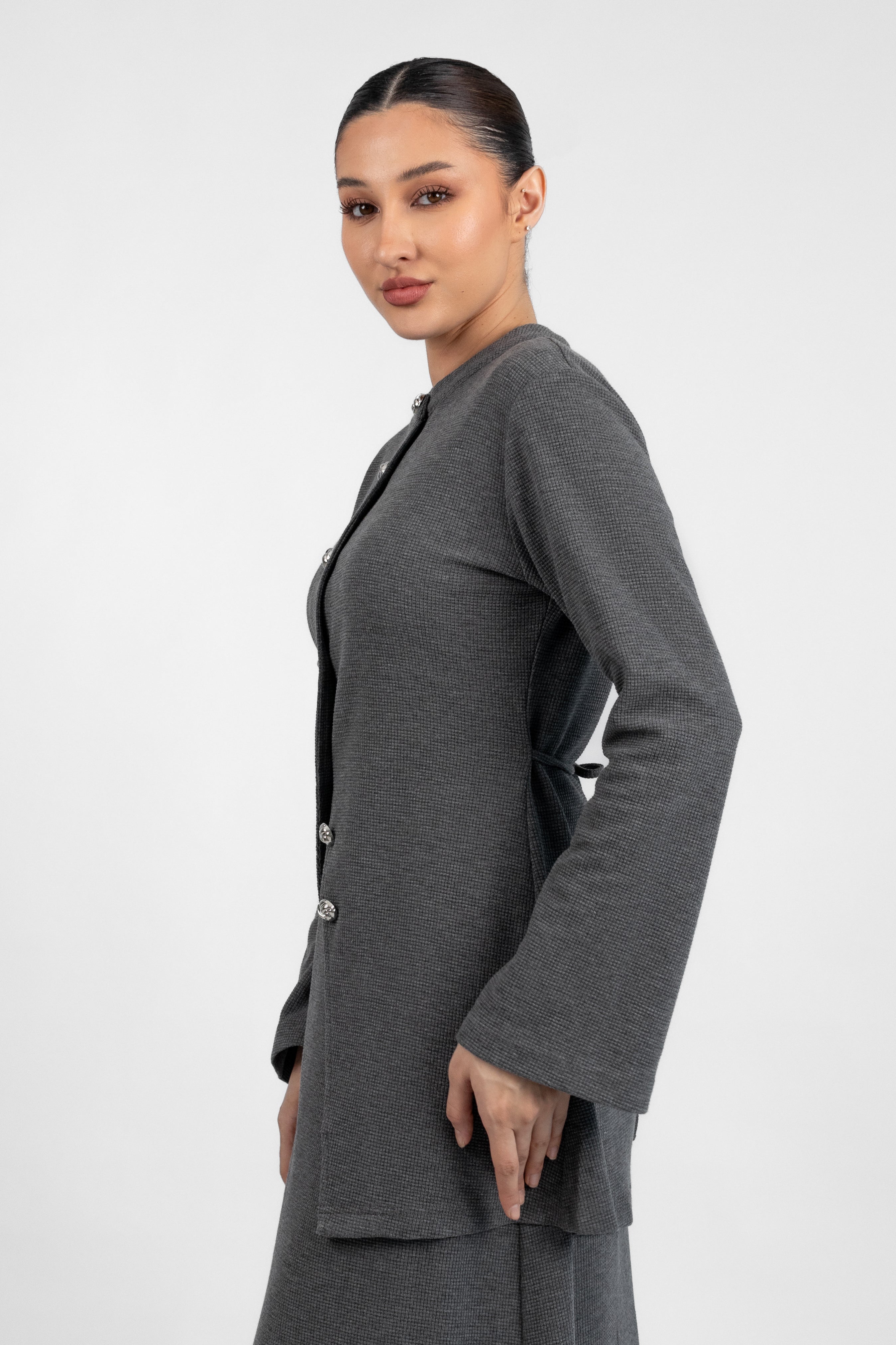 A side pose froma  model in a Tailored Vintage Cardigan.