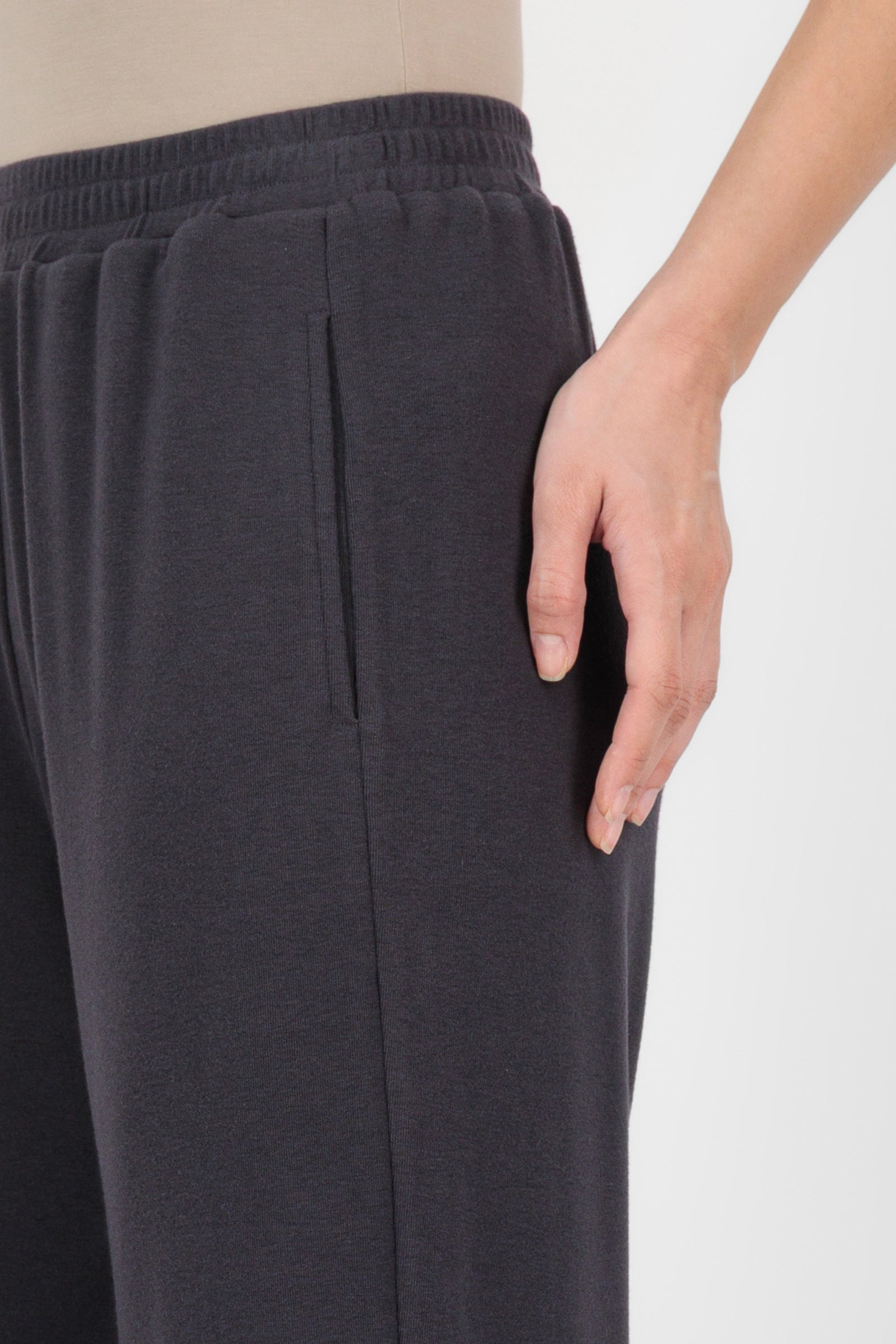 Close-up of the Straight Leg Knit Pants Charcoal focusing on the textured knit, waistband detail, and clean stitching that elevate classic straight leg pants.