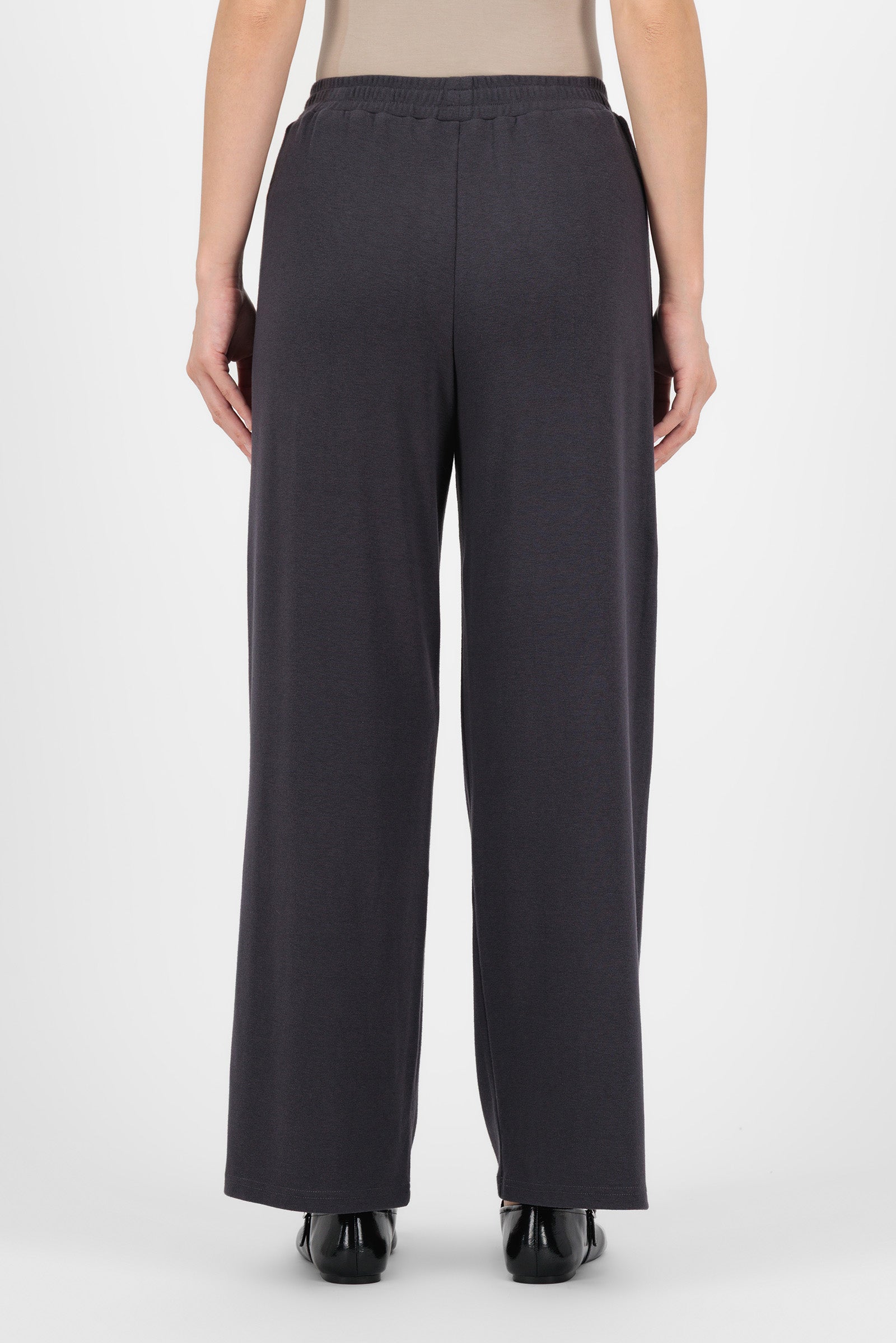 Back view of the Charcoal Straight Leg Knit Pants highlighting the smooth waistband and relaxed cut that give these straight leg pants a polished, easy fit.