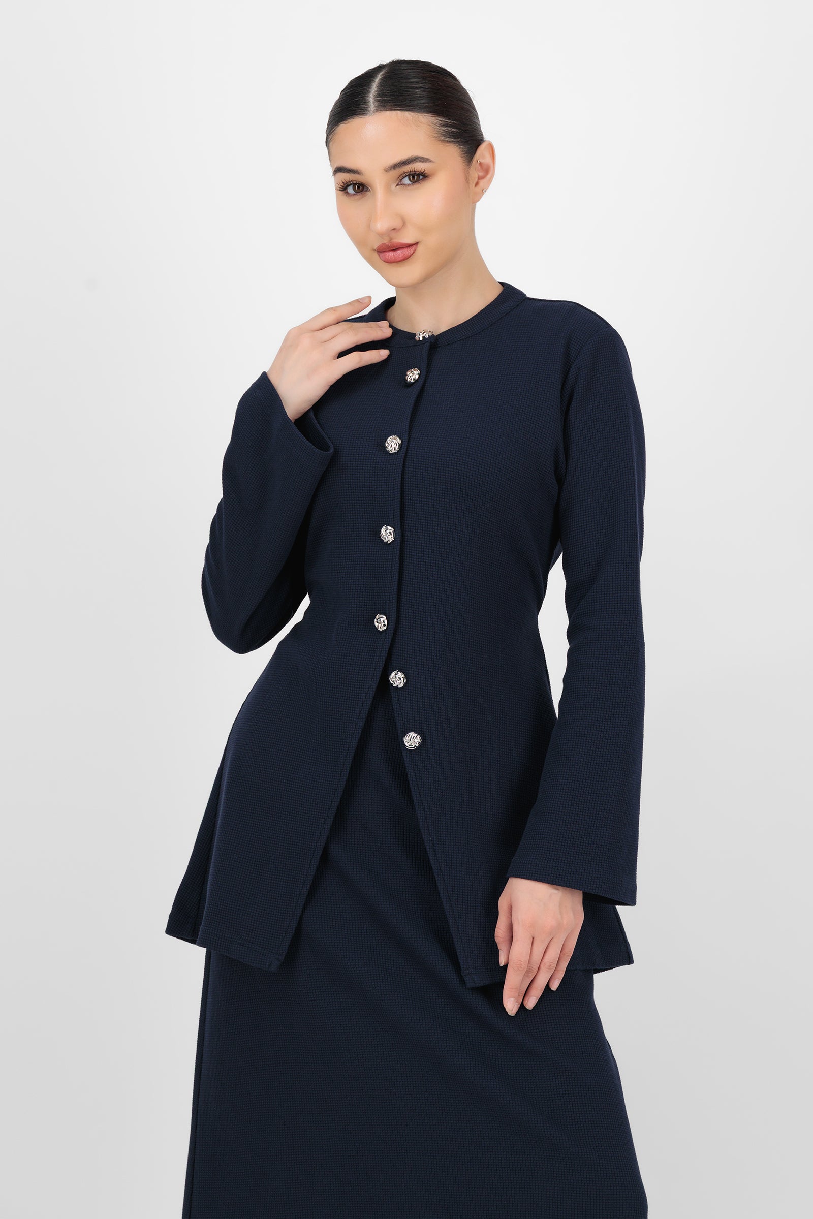 Alternate front pose of the Navy Tailored Vintage Cardigan showing the button detail and flattering structure that set it apart from everyday cardigans.