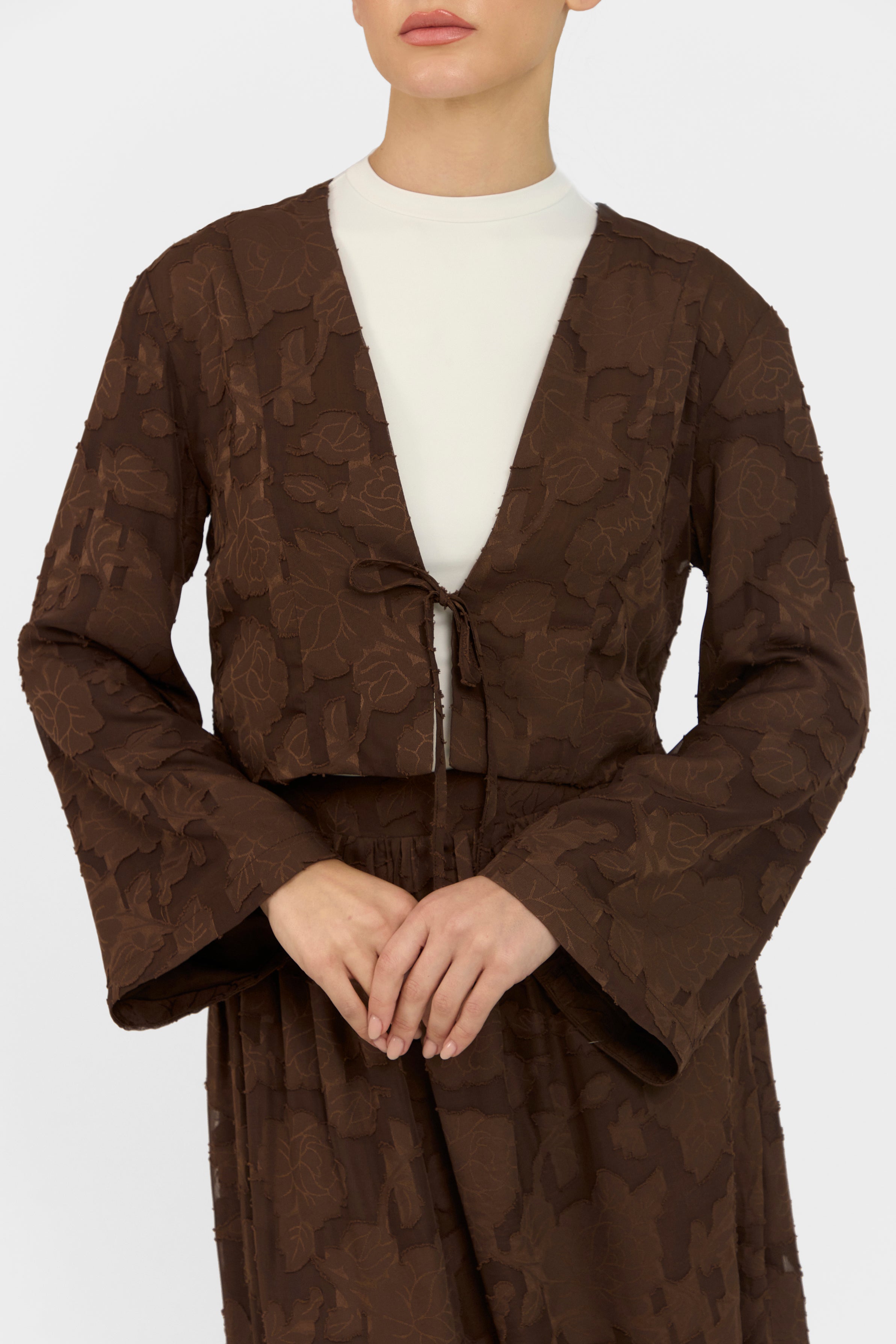 A close up of a Floral Cut Out Cropped Cardigan and Skirt Set 	Colour: Chocolate
