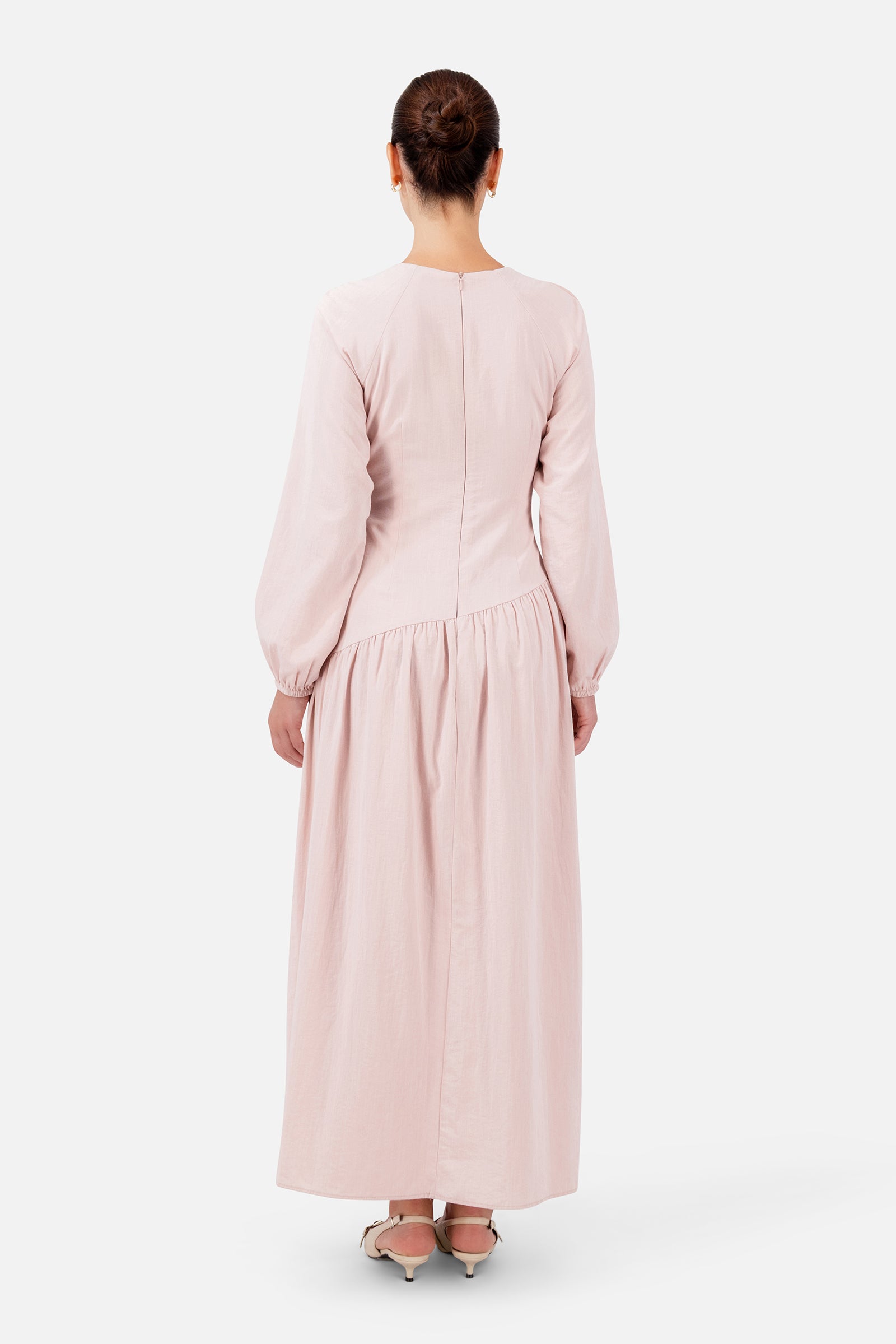 FARES Flower Accent Gathered Dress in Ballet Pink shown from the back, featuring a flowing full-length silhouette for elegant summer dresses.