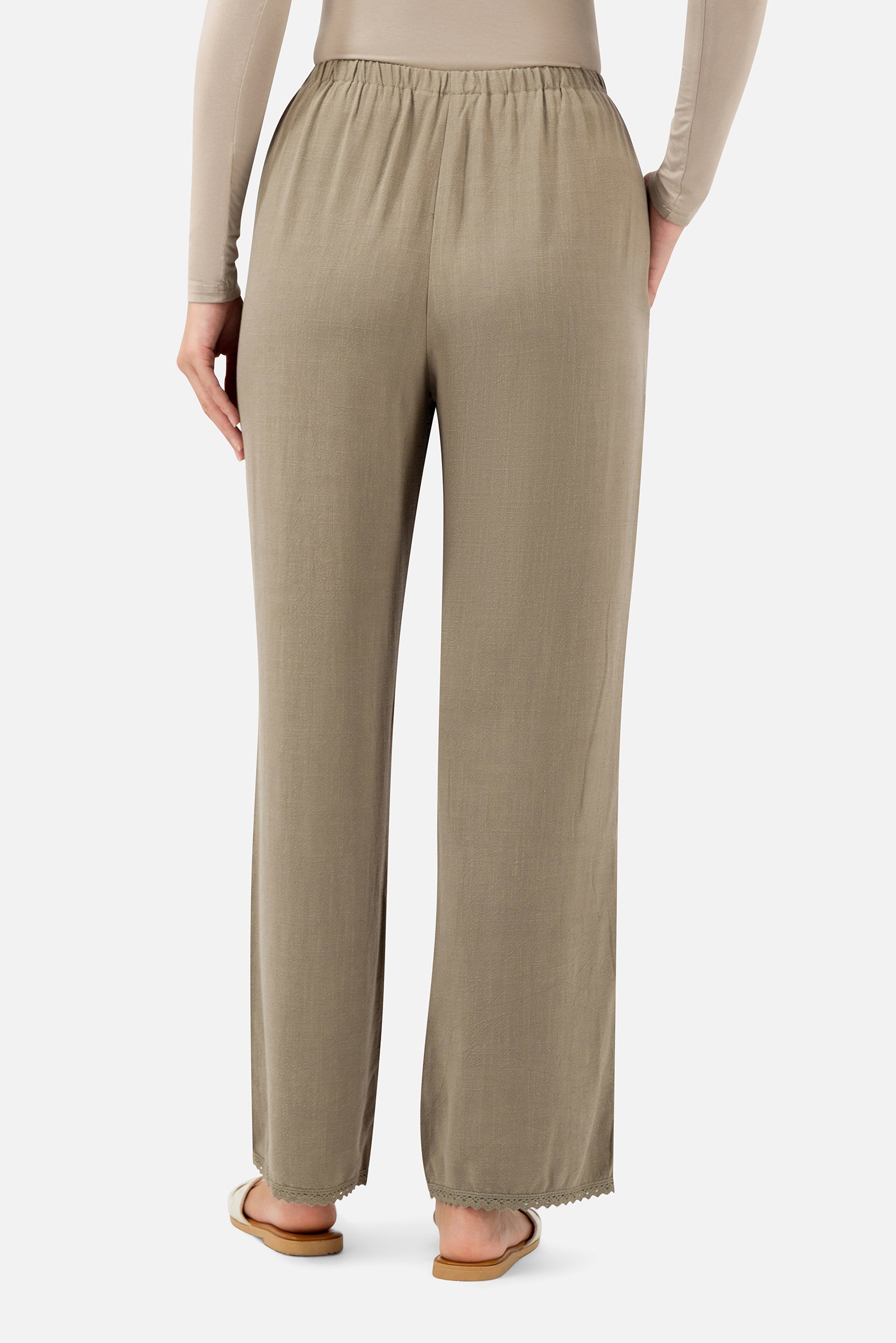 Back view of the Haze linen pants for women showcasing the relaxed fit and full-length design.