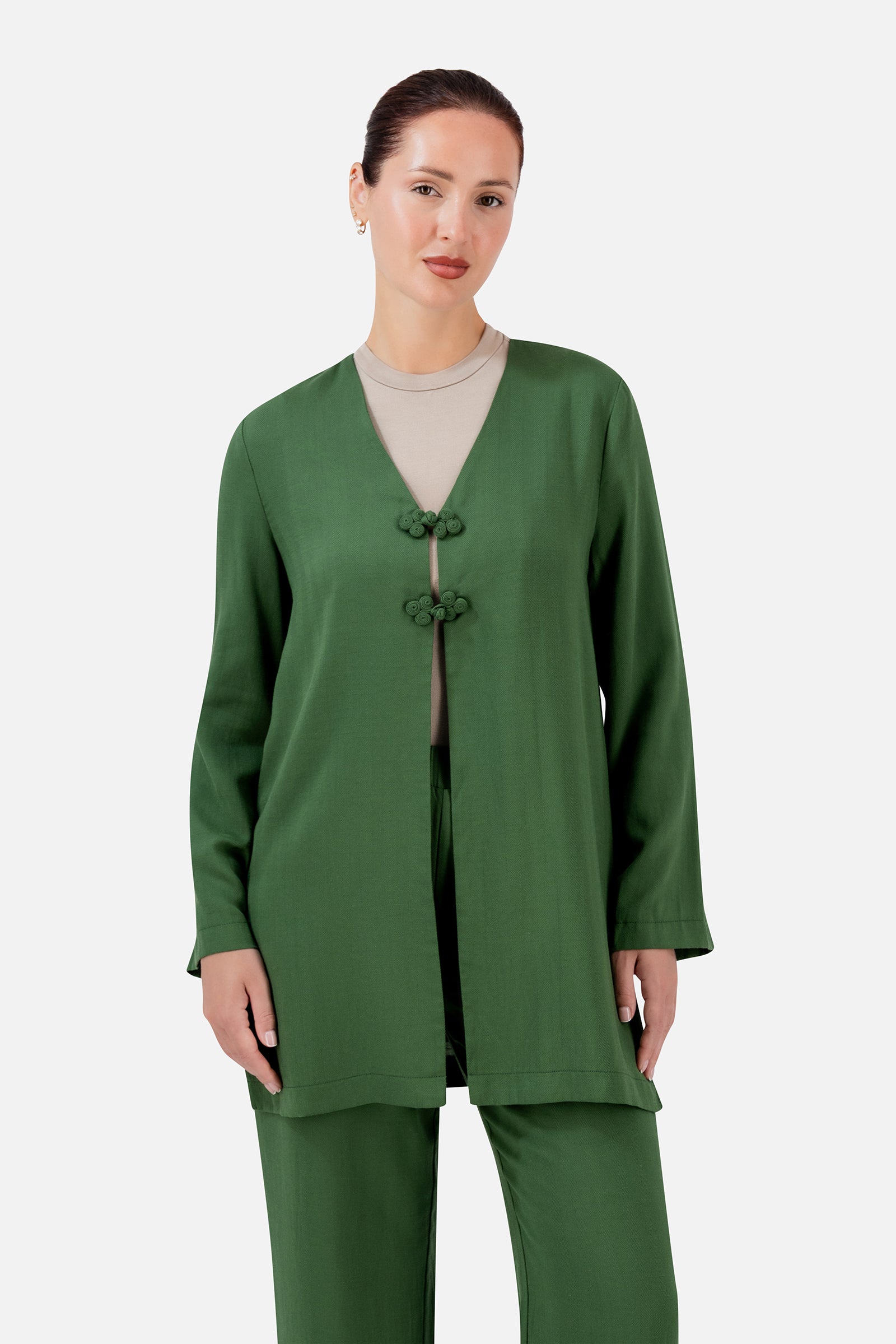 FARES Knot Detail Cardigan in Evergreen, a rich green cardigan for women with statement knot closures and a relaxed longline silhouette.