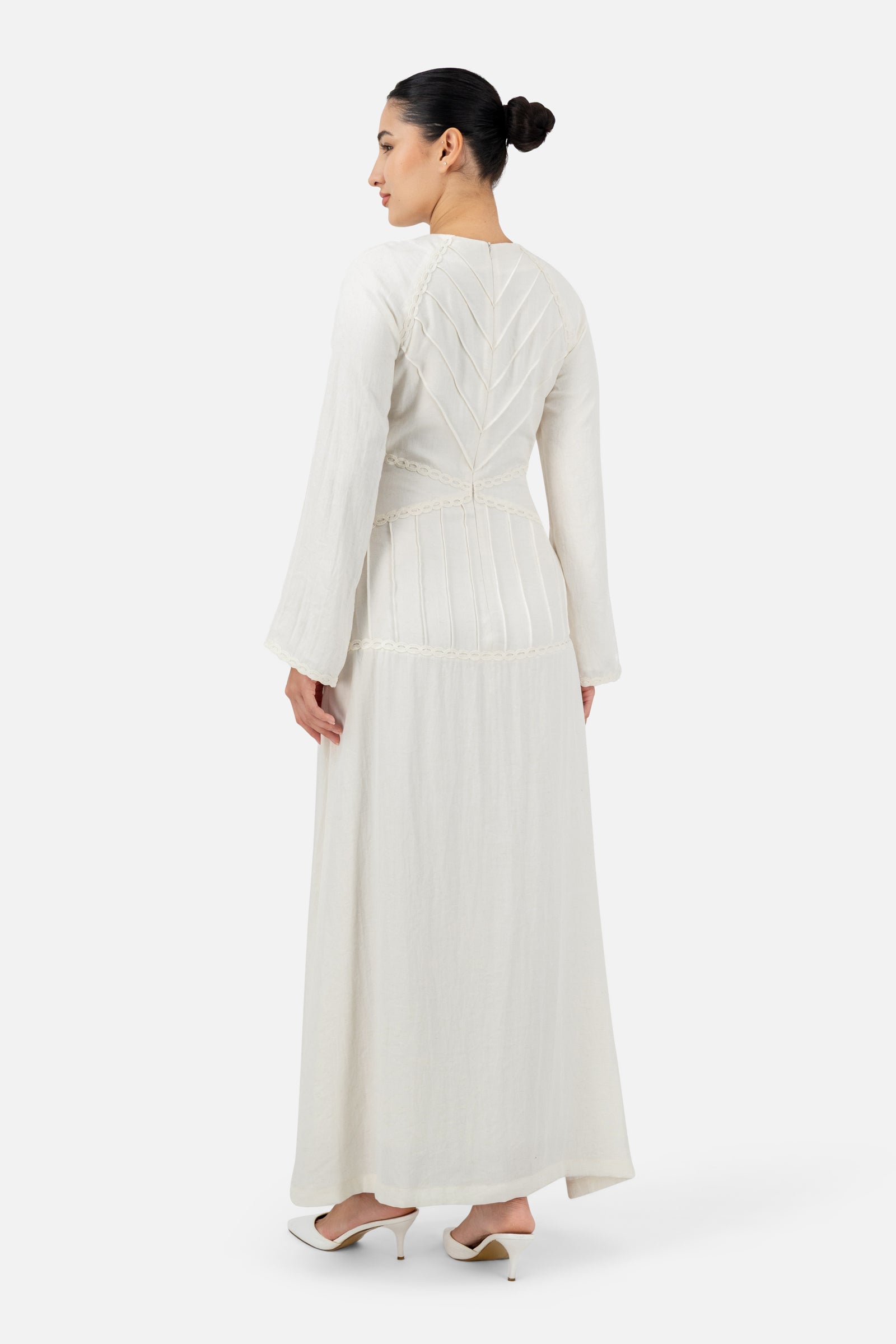 Back view of the White Ivory maxi dress showcasing the clean lines and graceful drape.