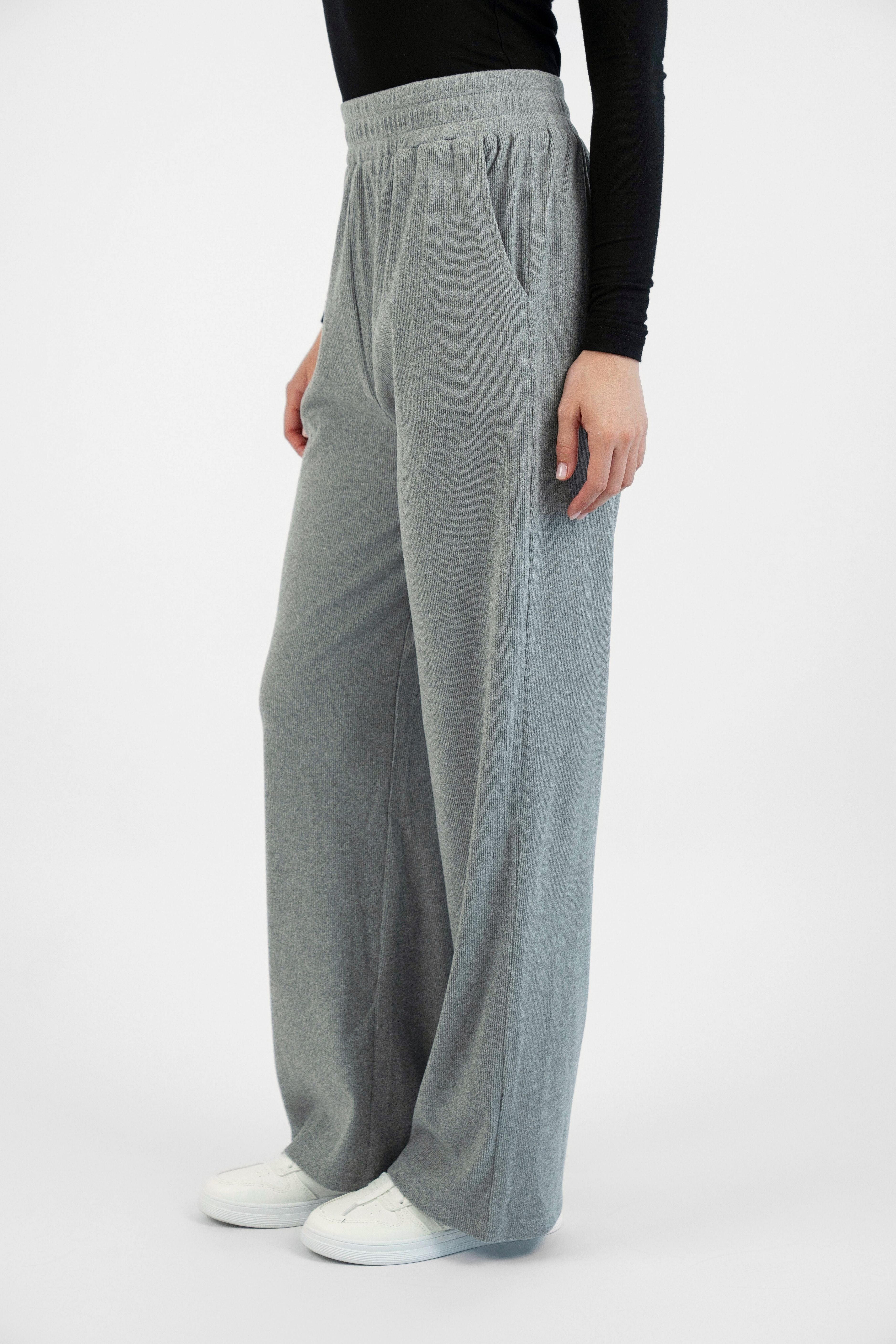 FARES' velour pants are shown from the left side. Colour description: Heather Grey.