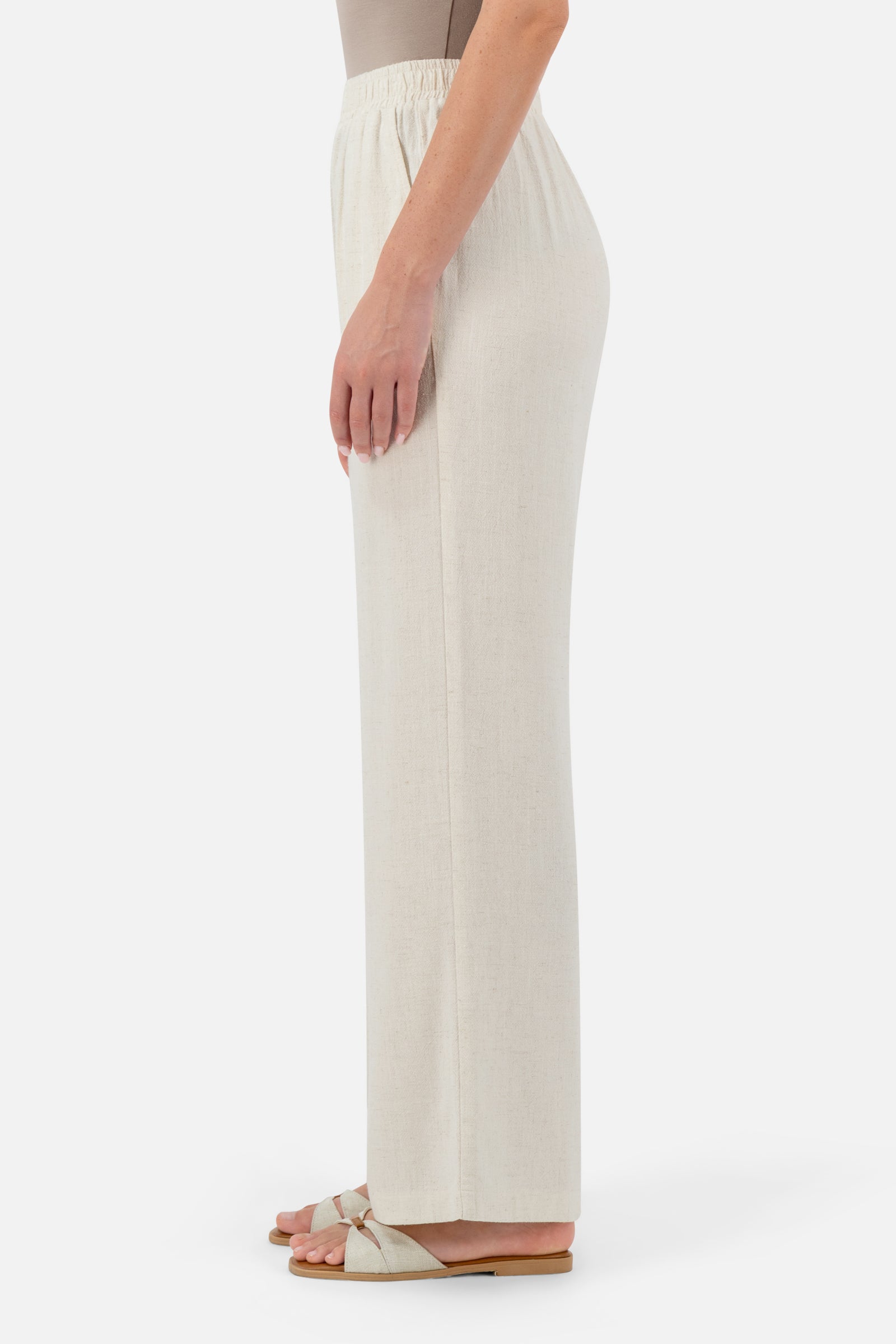 Side profile of the Vanilla pants for women highlighting the lightweight linen fabric.