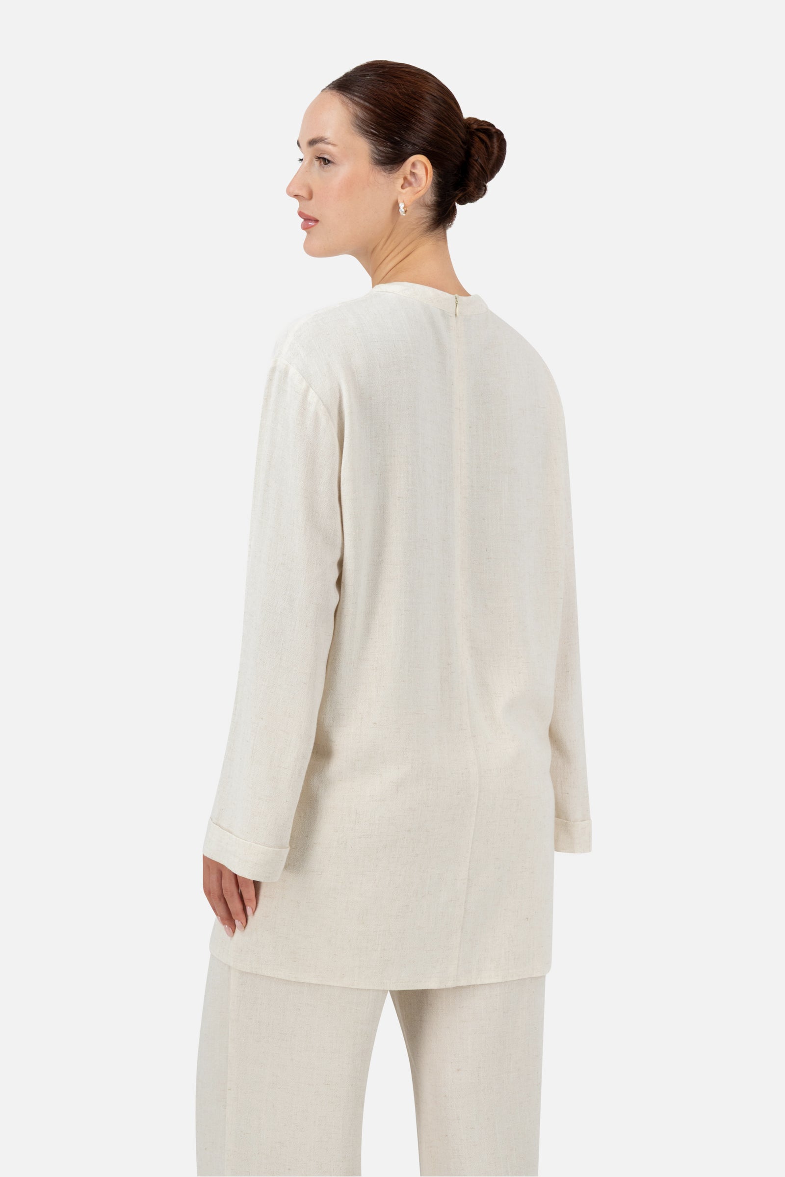 Back view of the Vanilla linen top showcasing the oversized fit and long sleeves.
