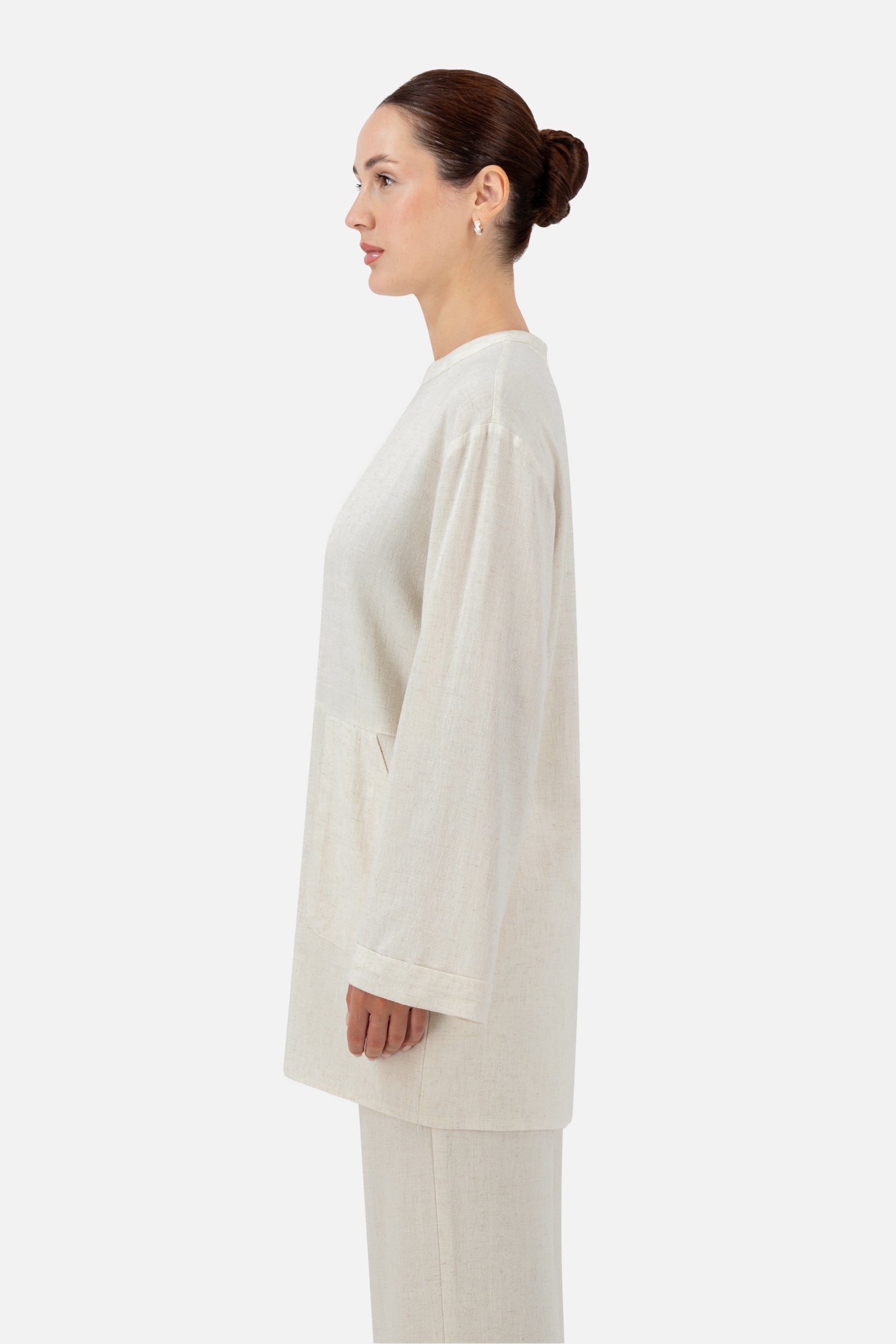 Side profile of the Vanilla linen blend top highlighting its soft drape and relaxed shape.