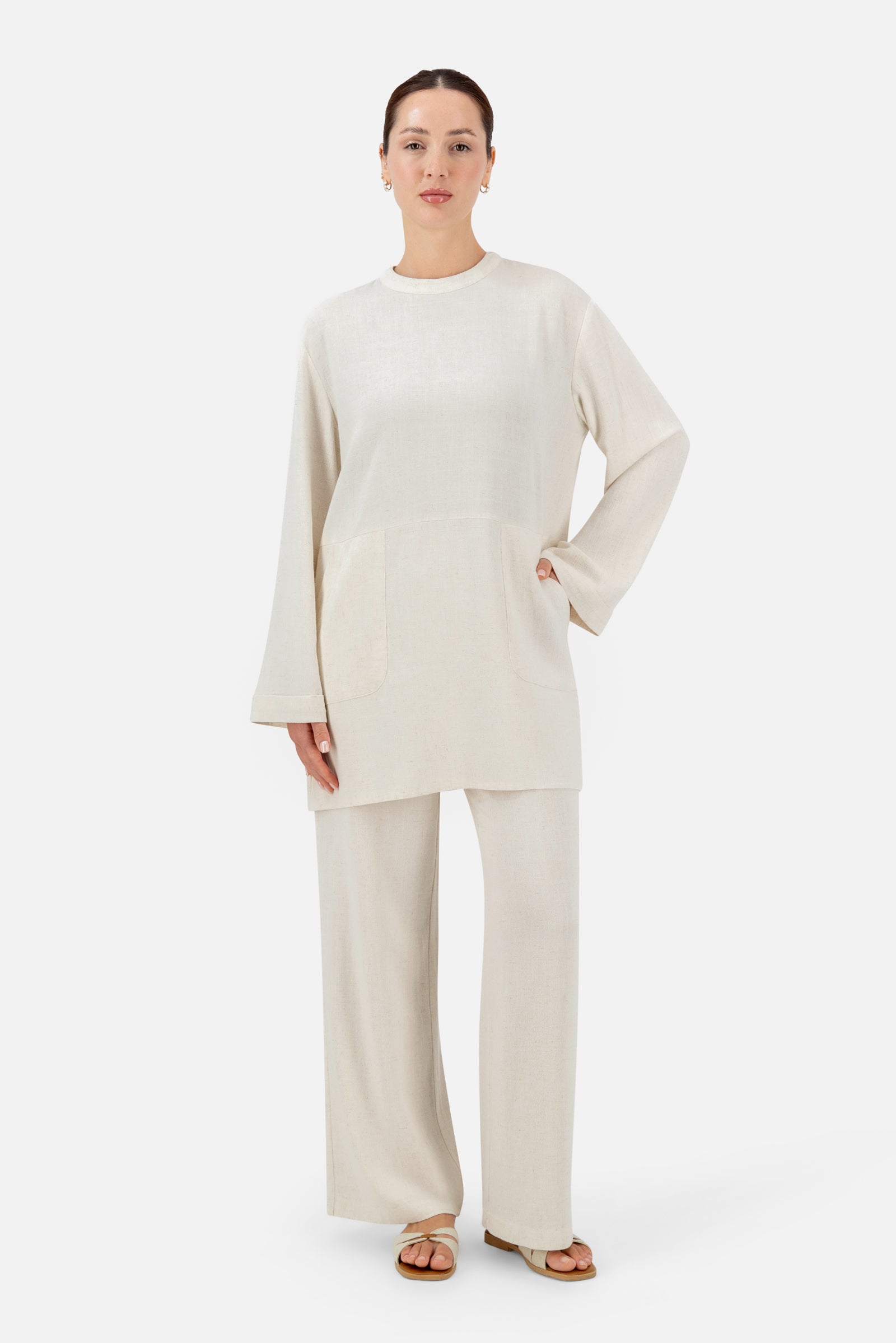 Full-length view of the model wearing the Vanilla linen top as part of a coordinated two-piece outfit.
