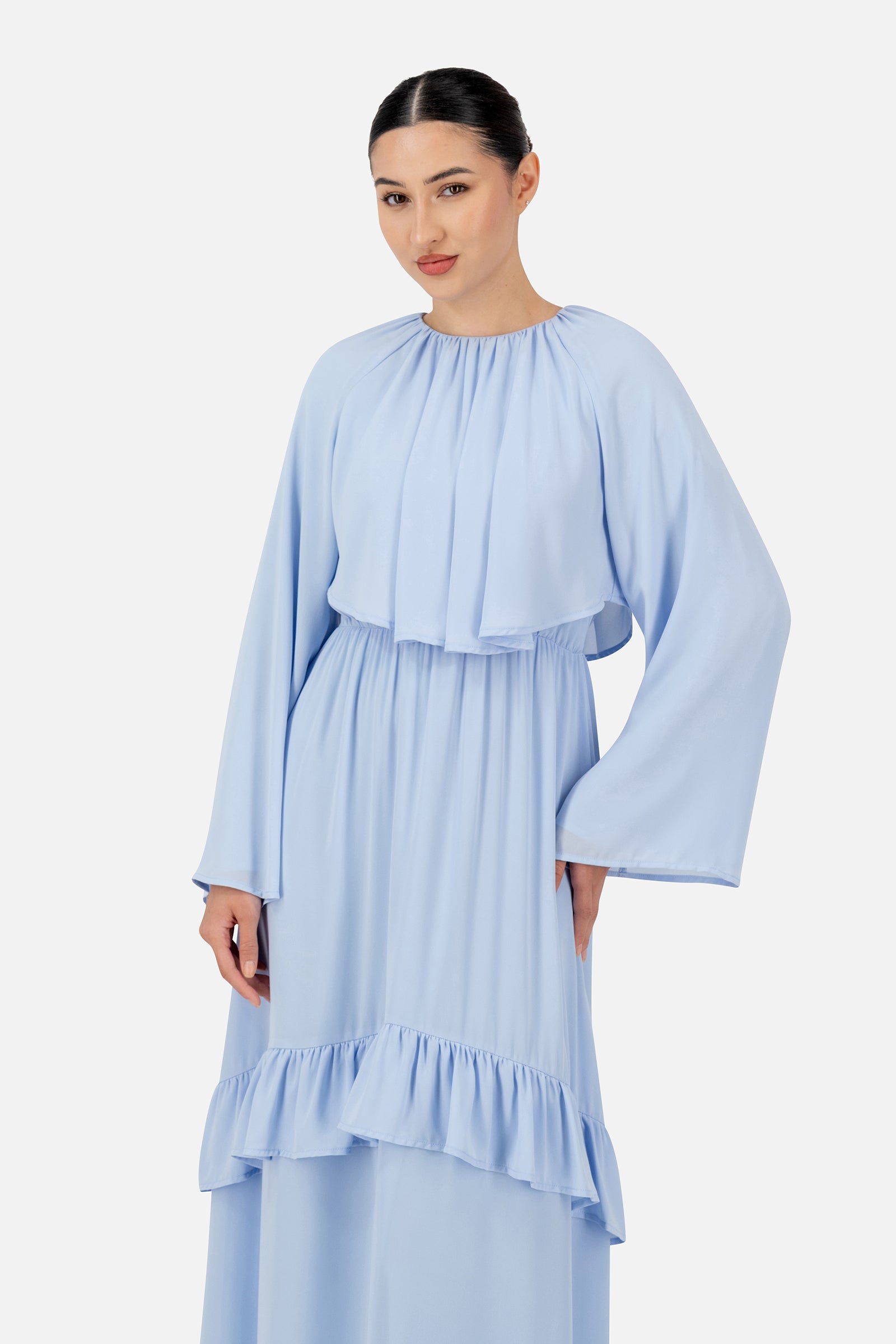 Close-up of the FARES Chiffon Layer Dress in Powder Blue featuring delicate chiffon layers and gathered detailing on the maxi dress.