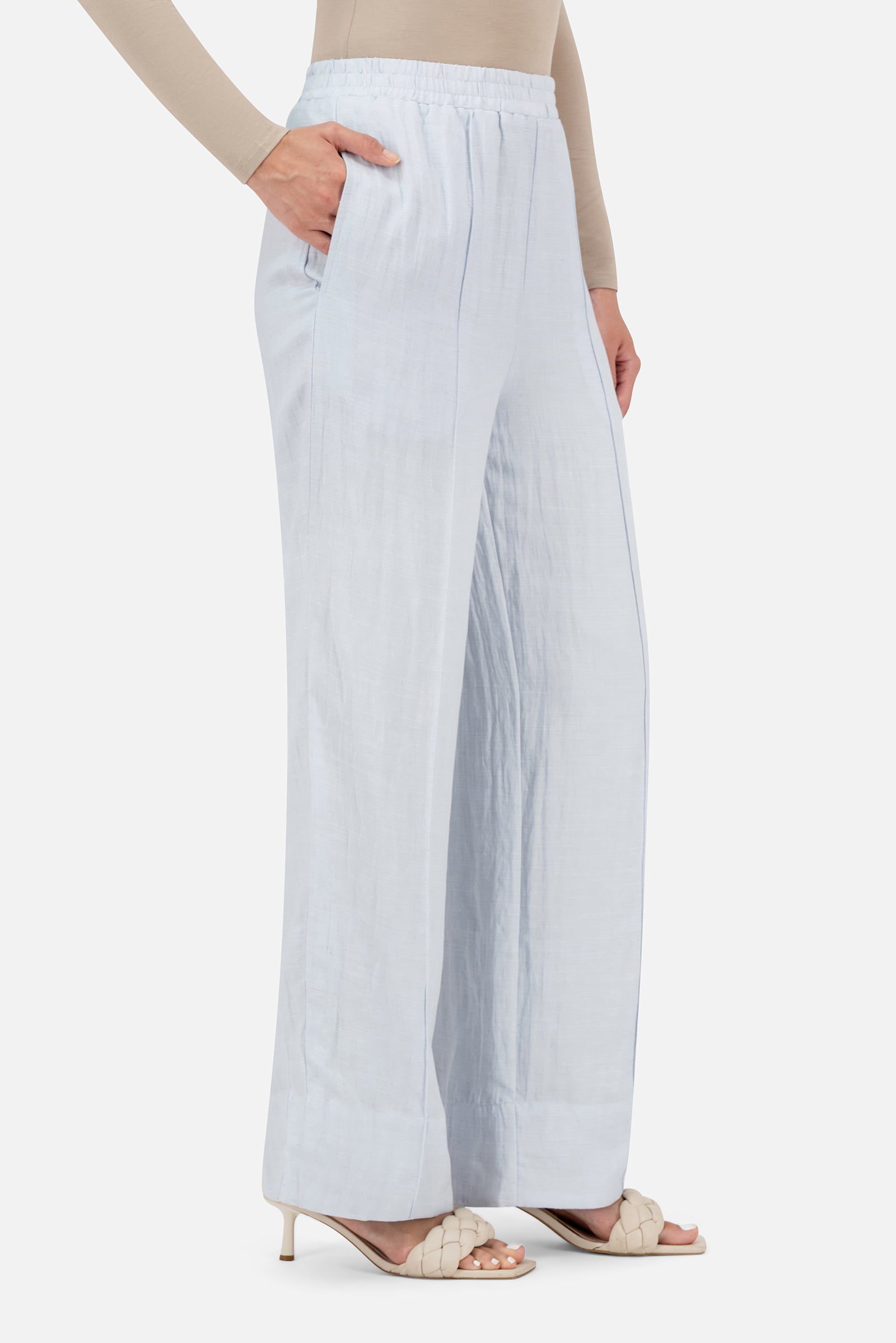 Girl posing in the Blueberry Cream FARES pants for women with a flowing silhouette and comfortable elastic waistband.