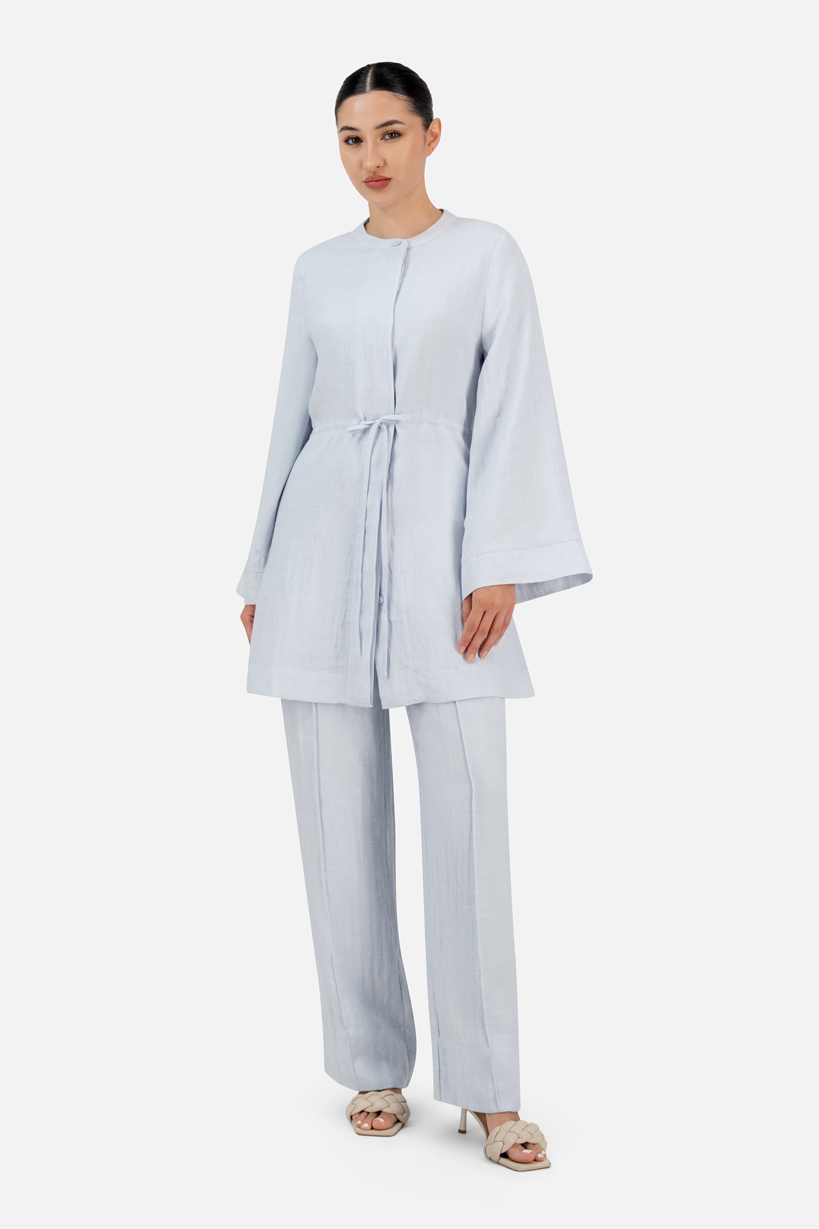 Woman styled in the Blueberry Cream FARES pants for women set showcasing the elegant drape and relaxed tailoring.