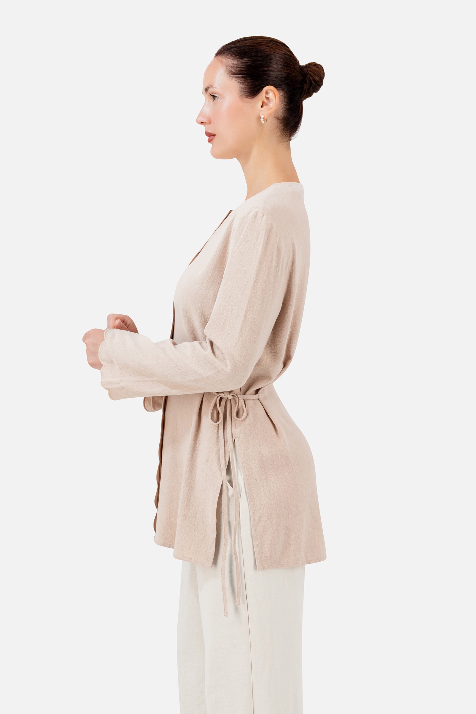 FARES Scalloped Detail Linen Blend Top in Shell shown from the side, featuring the adjustable side ties and relaxed shape of this top for women.