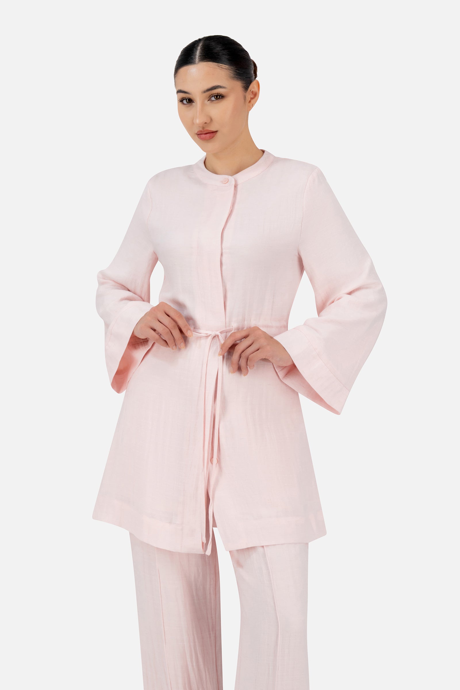 Girl posing in the Strawberry Cream FARES tunic with soft tailoring and an adjustable waist for a graceful shape.