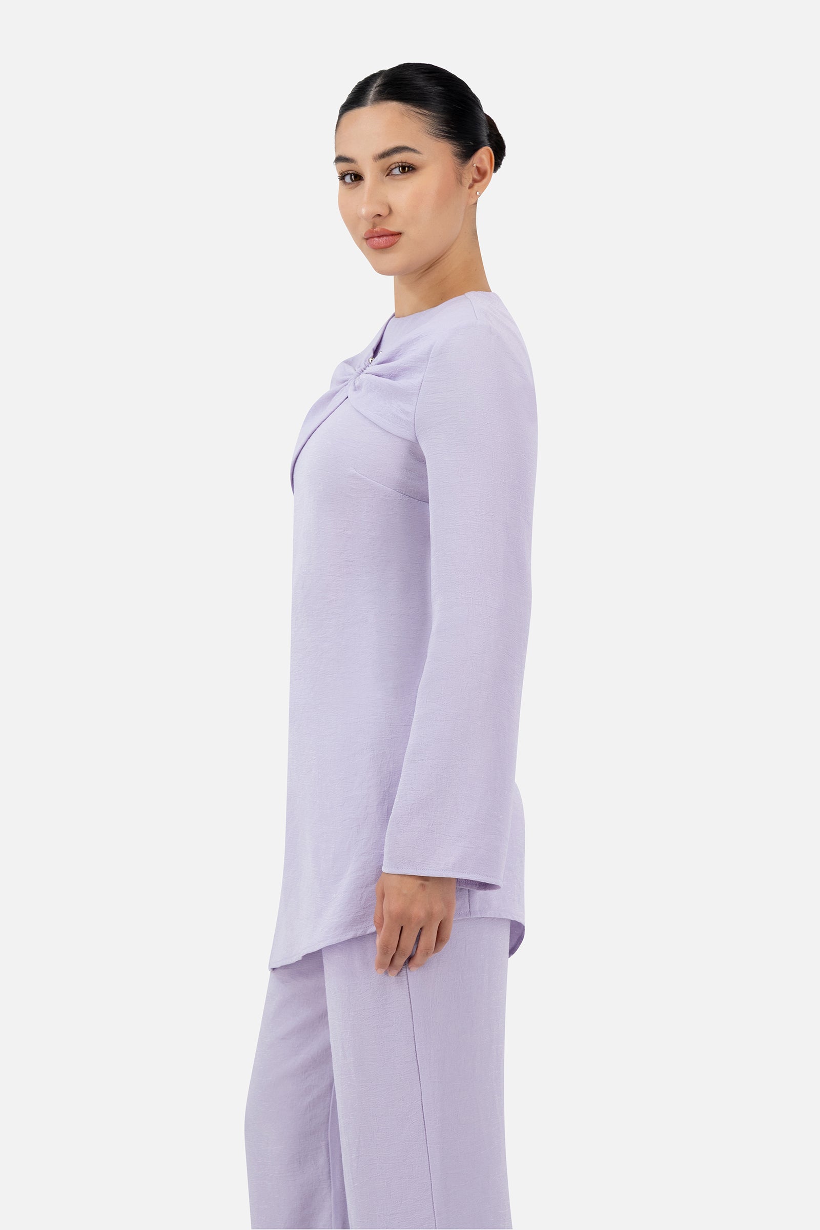 Side profile of the Lilac gathered ring asymmetric tunic highlighting its flattering drape.