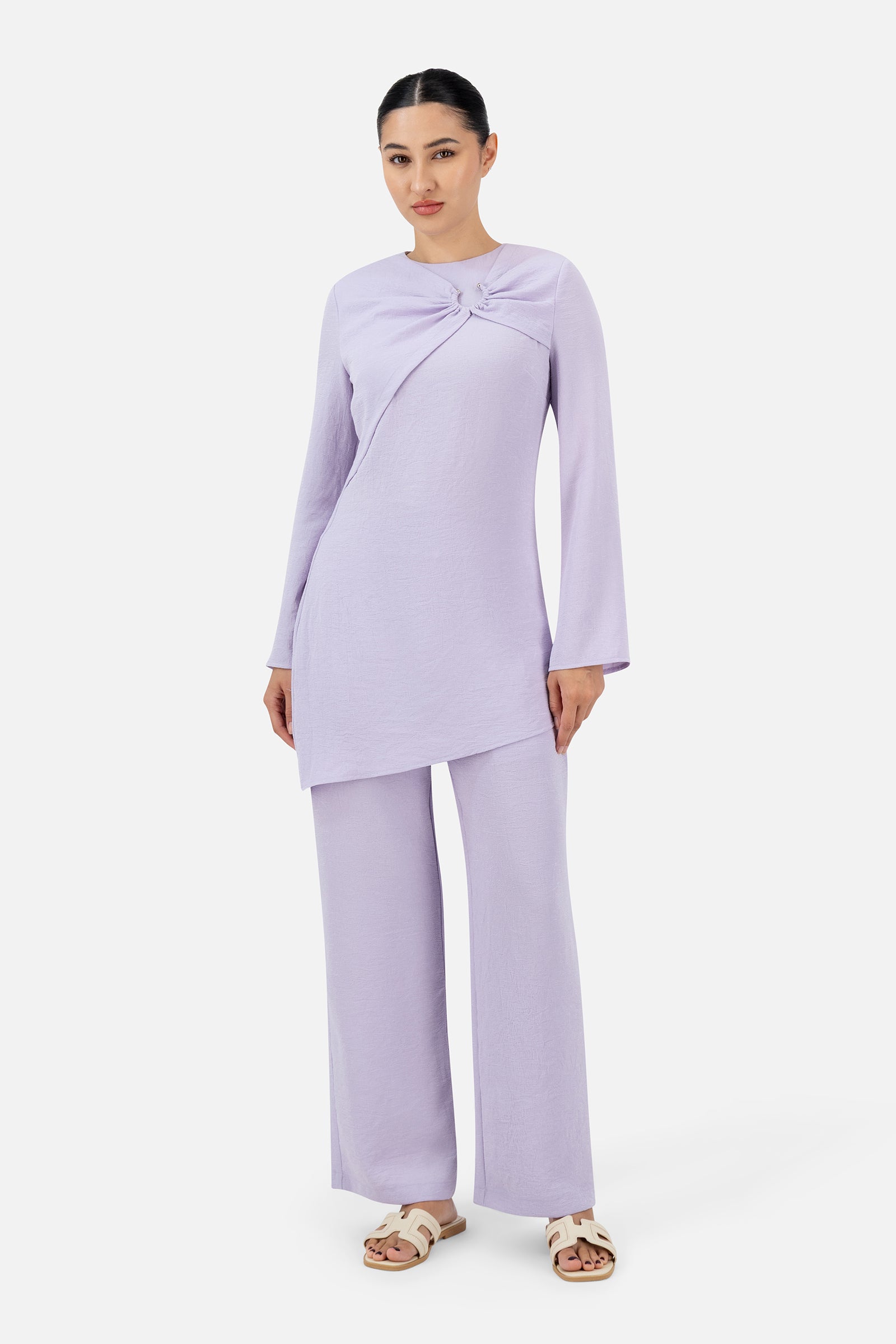 Full-length view of the model wearing the Lilac relaxed fit pants with the coordinating tunic.