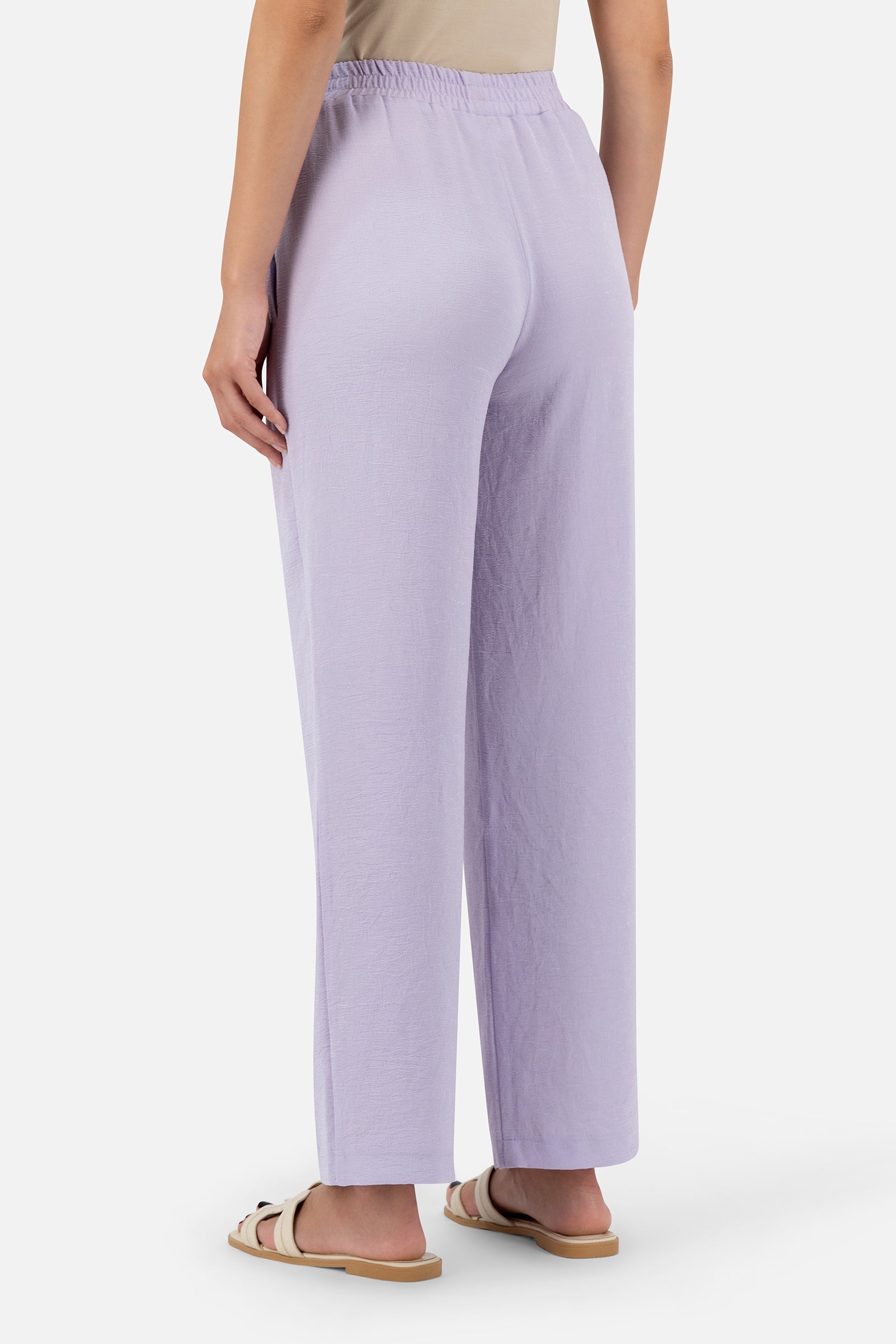 Back view of the Lilac relaxed fit pants showcasing the clean design and relaxed cut.