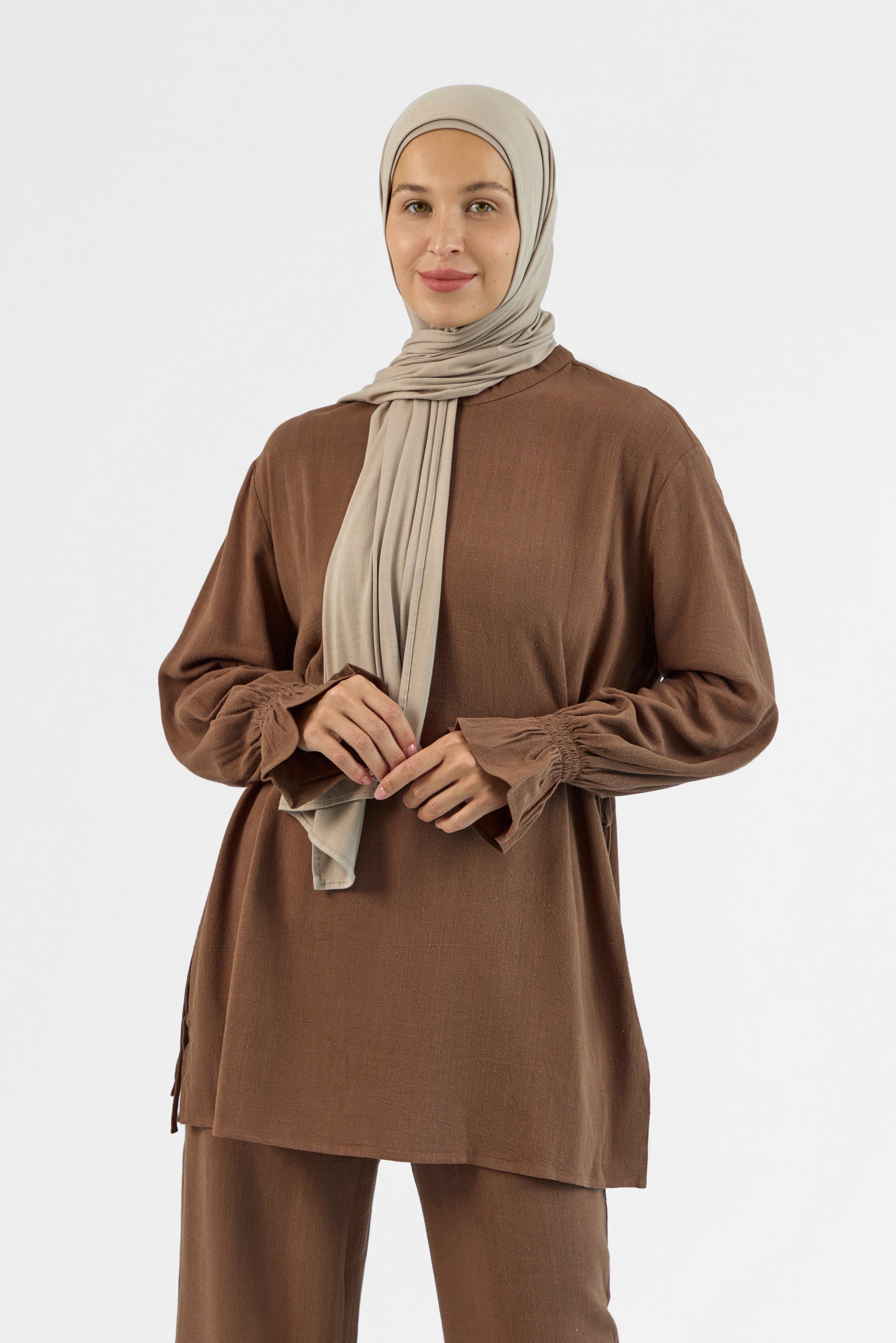Colour: Chocolate. A closer look of a girl posing in a Bow Detail Linen Blend Top.
