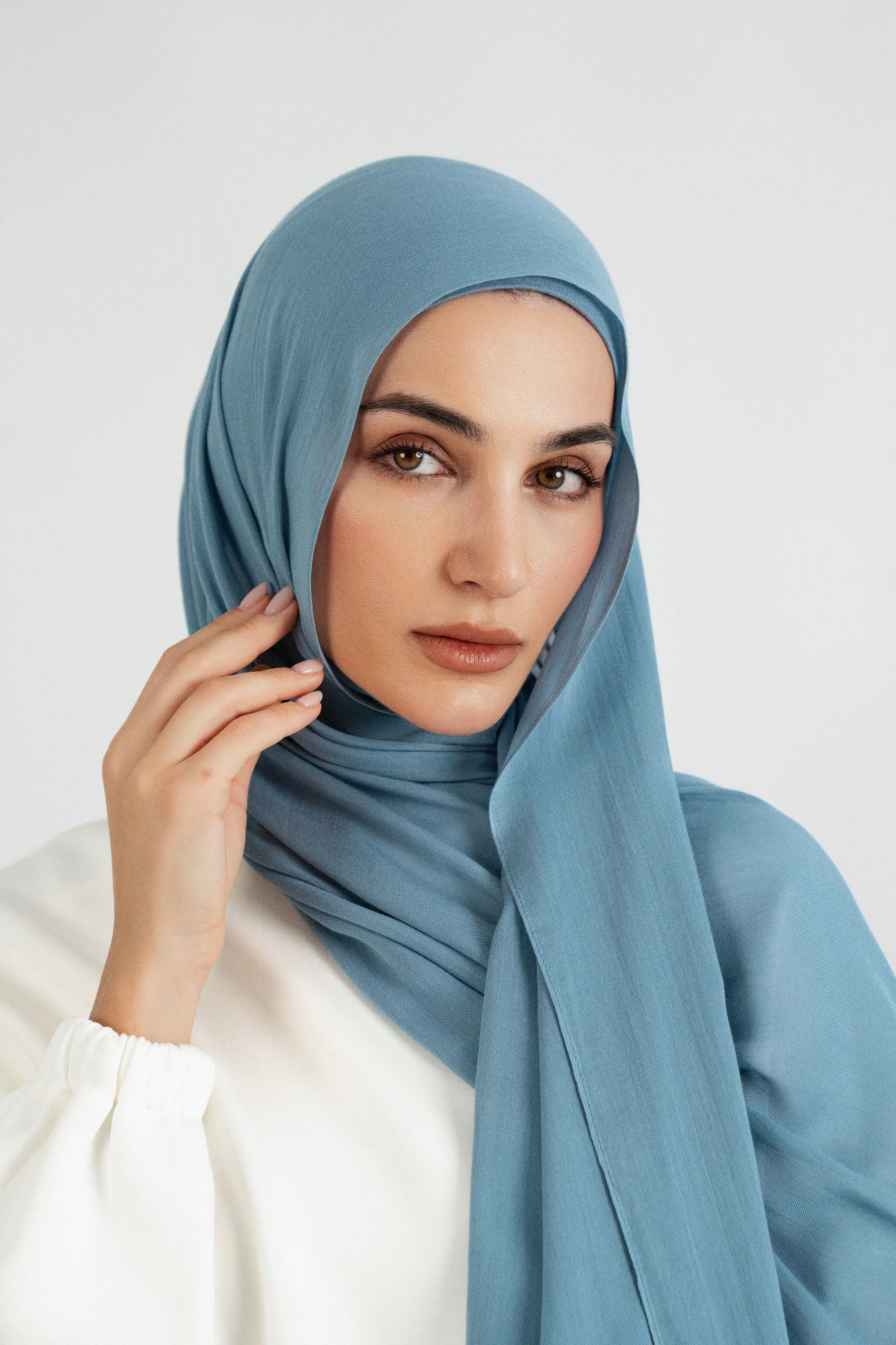 Colour: Marina. A close up of girl wearing a Matching Butter Modal Hijab Set