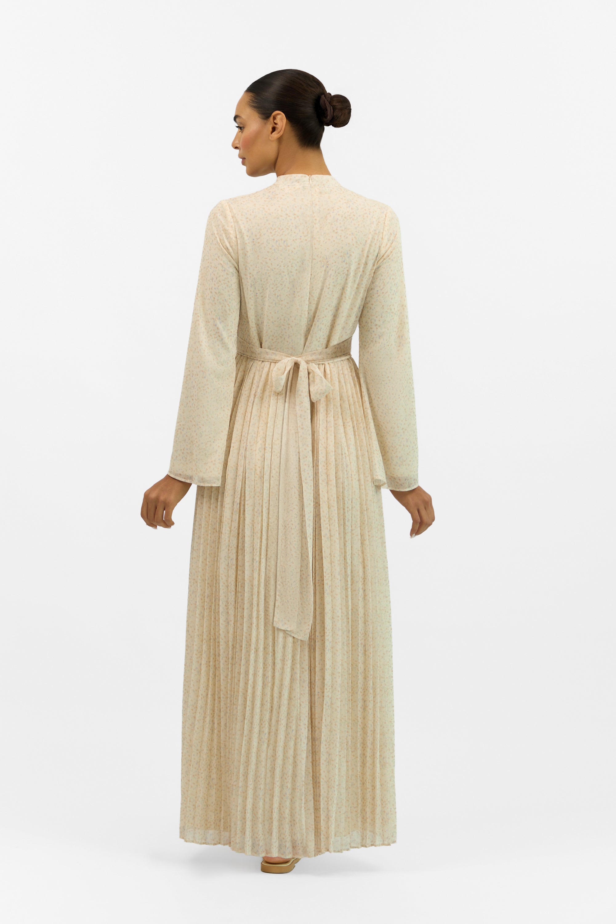 Back view of the FARES Printed Tie Dress with Pleats, highlighting the relaxed fit and delicate print throughout.