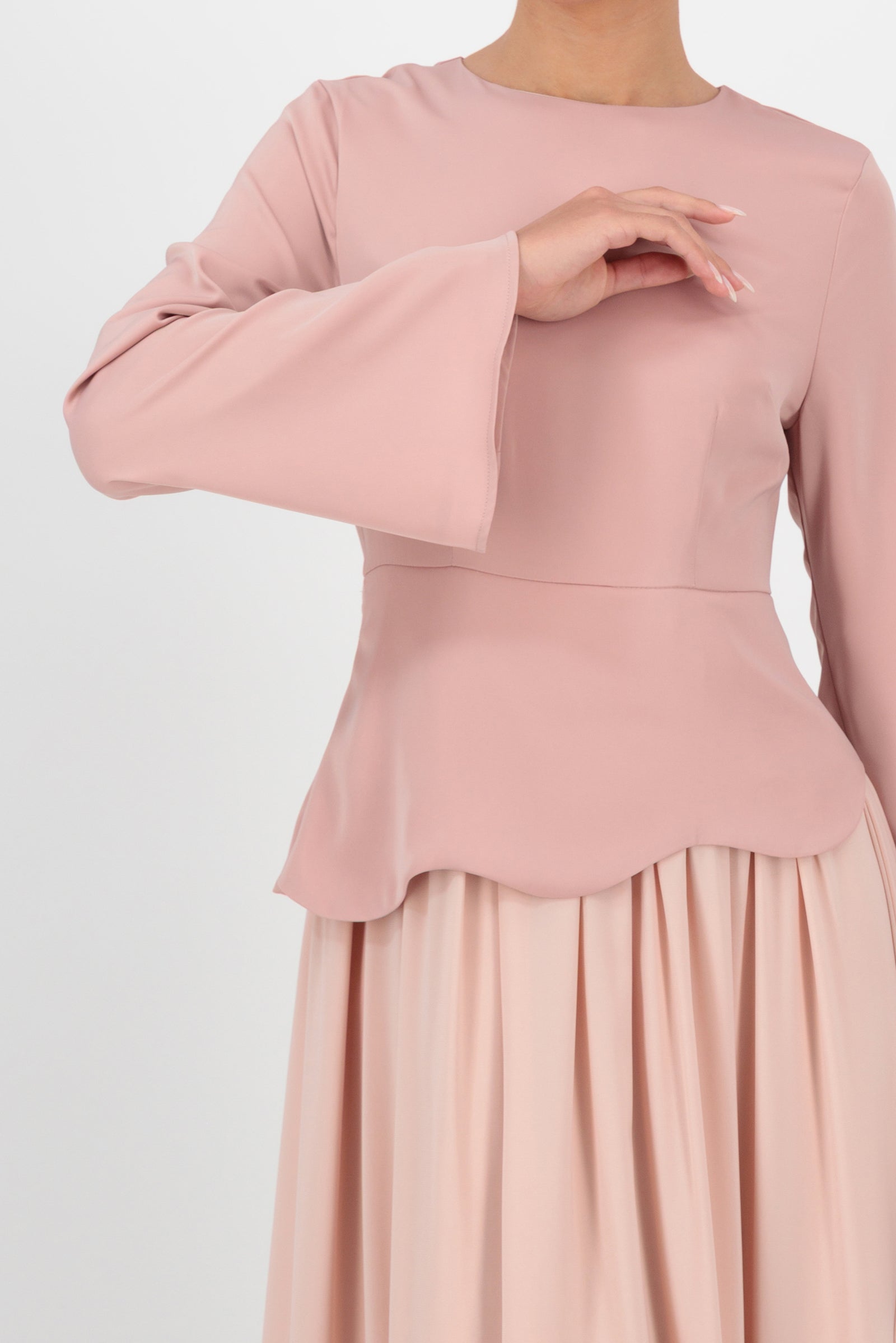 Close-up detail of the FARES Two Tone Scalloped Peplum Dress in Farawla captures the soft texture and precise scalloped finish that make it a distinctive option in dresses for women.