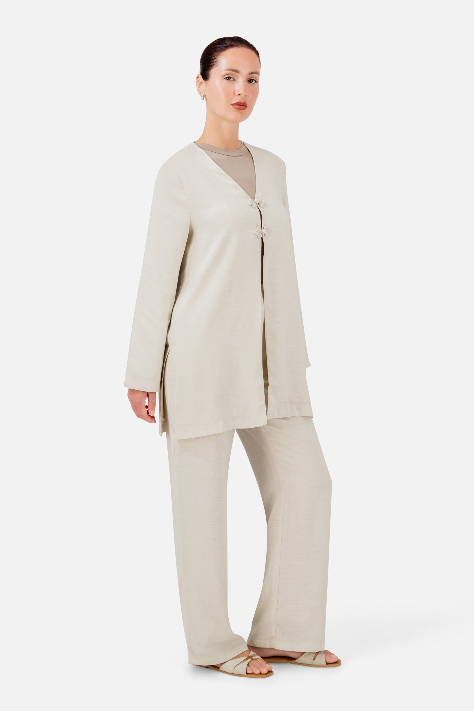 FARES Knot Detail Cardigan in Bare styled with matching pants, creating a soft and effortless coordinated look.