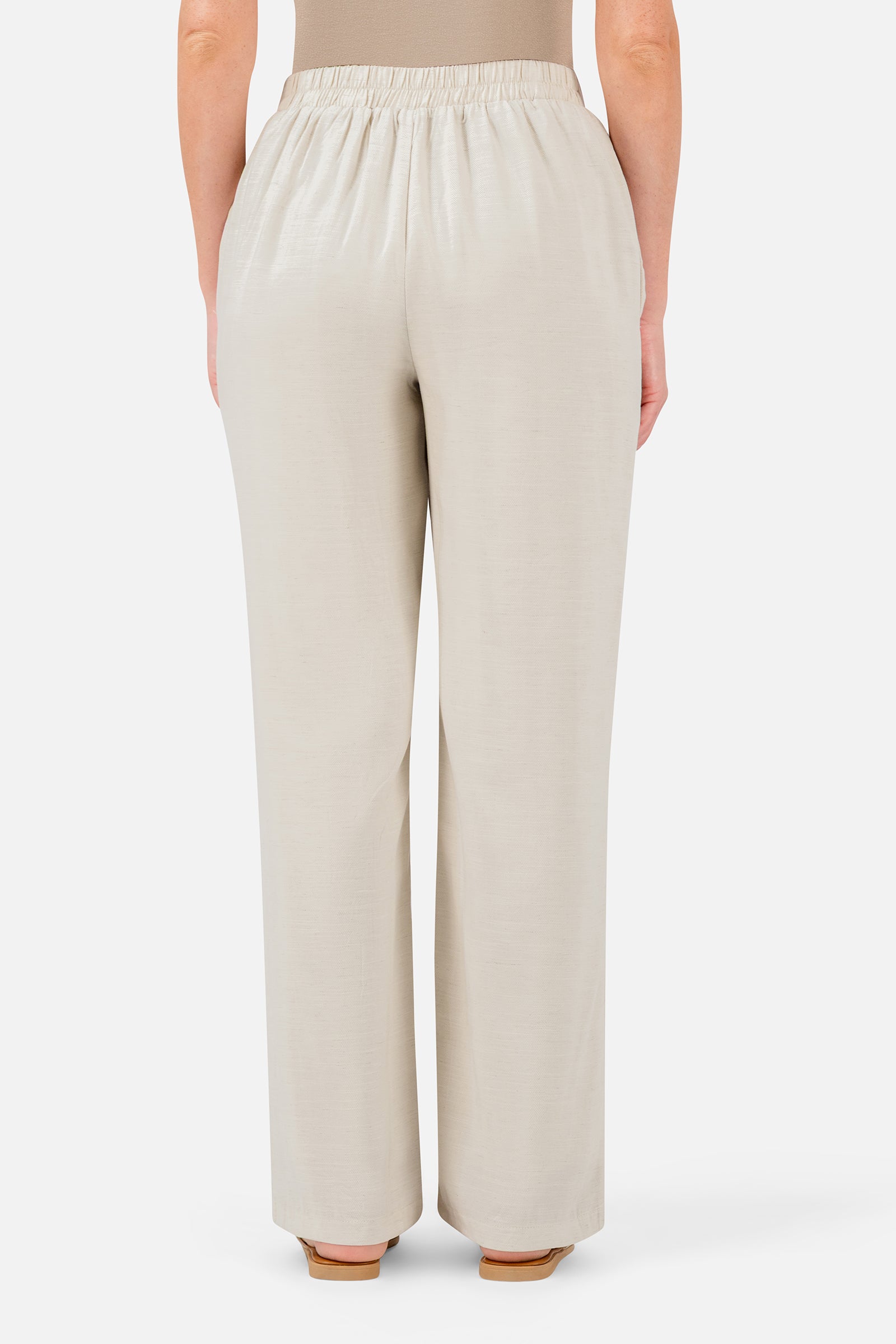 FARES Relaxed Fit Pants in Bare shown from the back, highlighting the relaxed silhouette and softly gathered elasticated waistband.